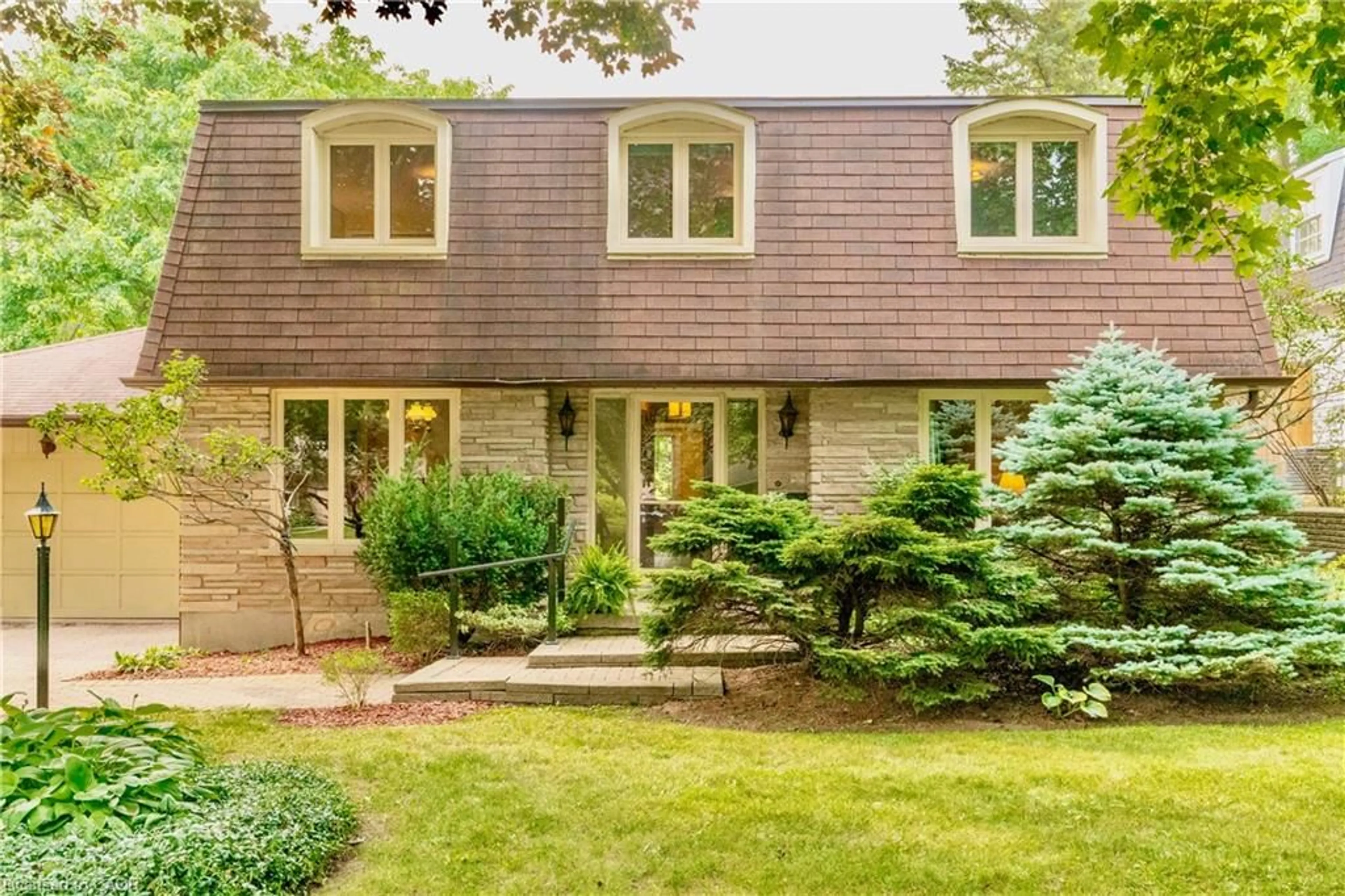 Home with brick exterior material, street for 32 Waverley Dr, Guelph Ontario N1E 6C8