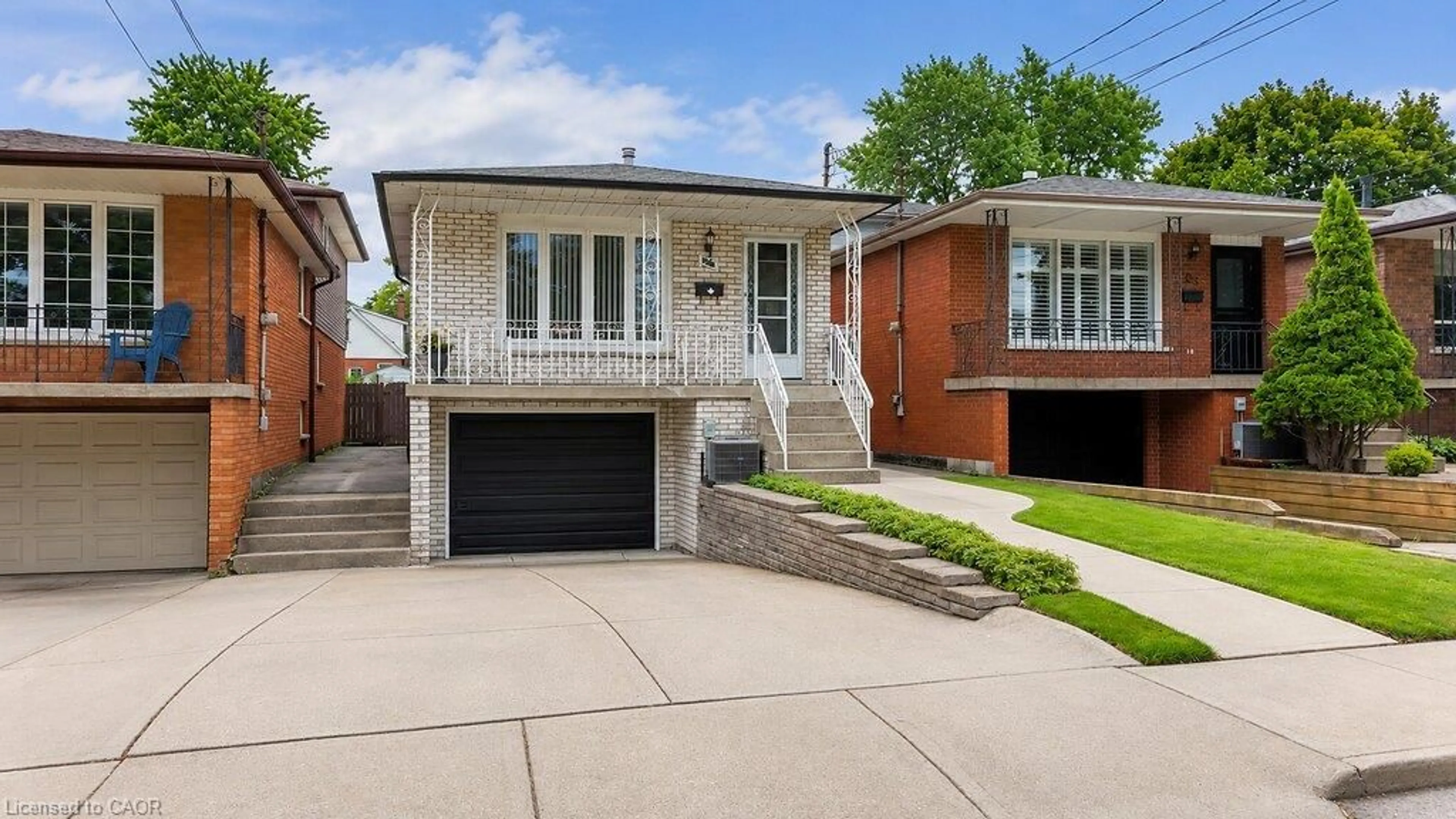 Home with brick exterior material, street for 229 East 8th St, Hamilton Ontario L9A 3L7