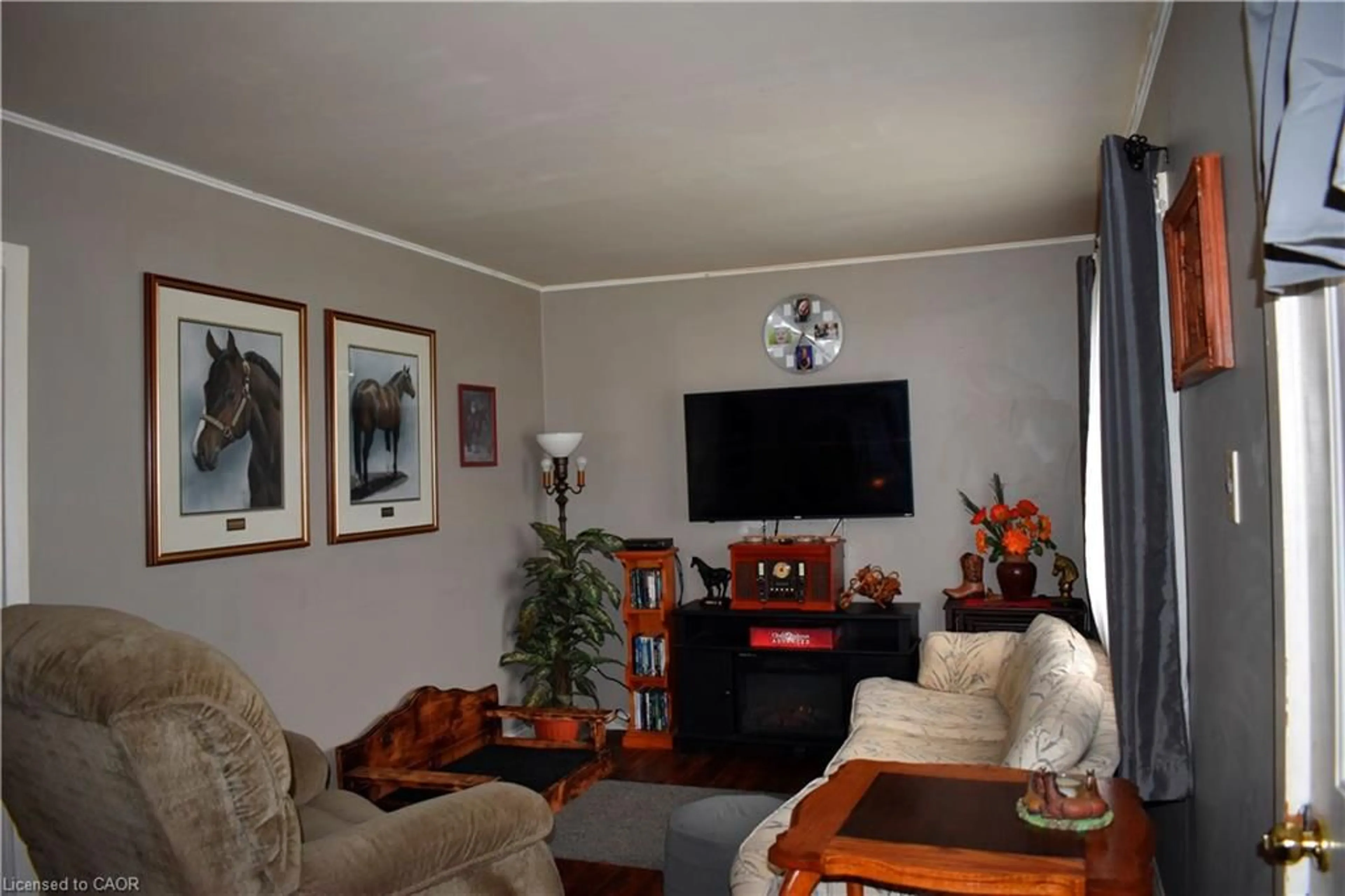 Living room with furniture, wood/laminate floor for 36 Woodhouse Ave, Port Dover Ontario N0A 1N8