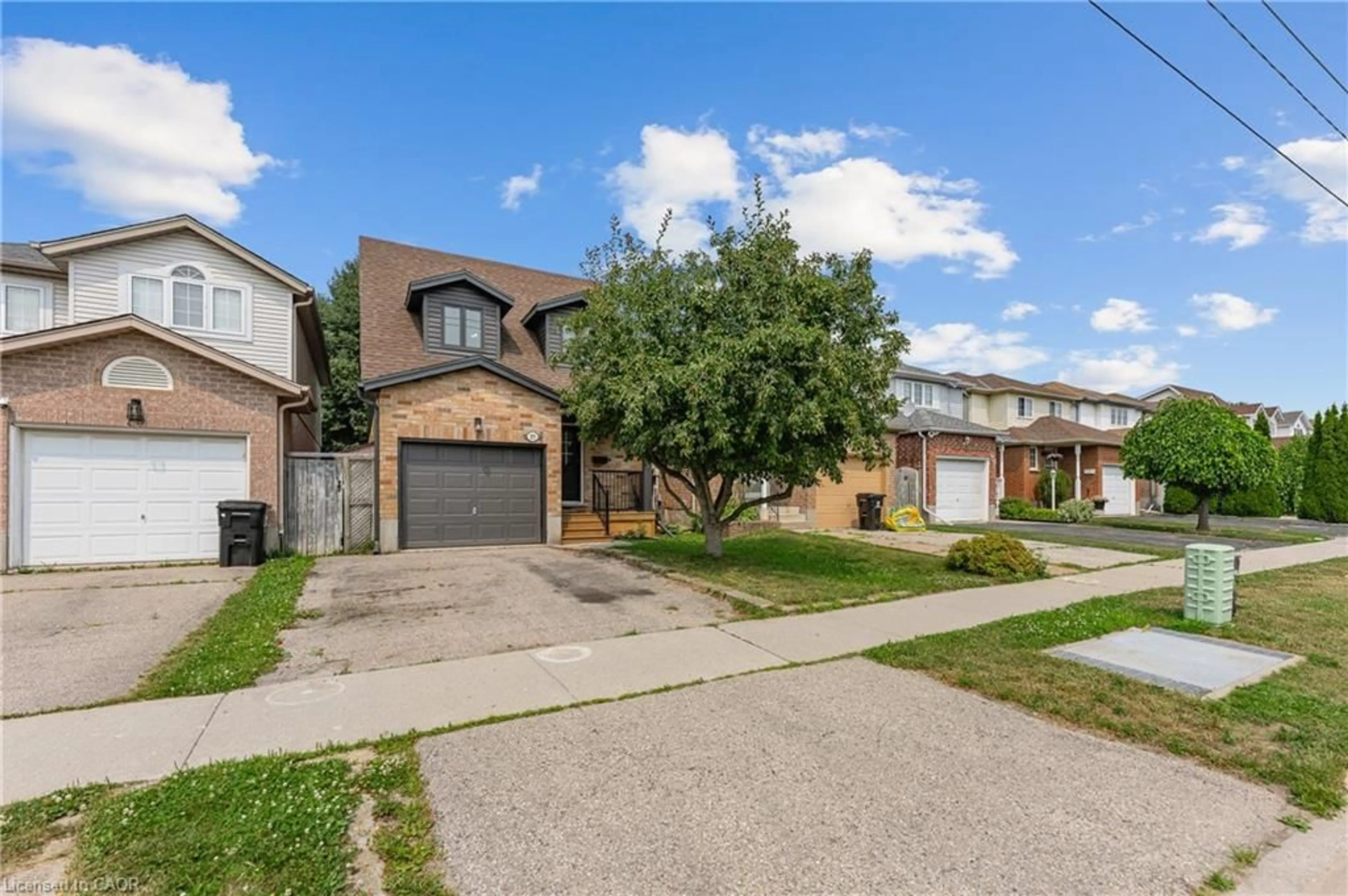 Home with brick exterior material, street for 77 Activa Ave, Kitchener Ontario N2E 3R4