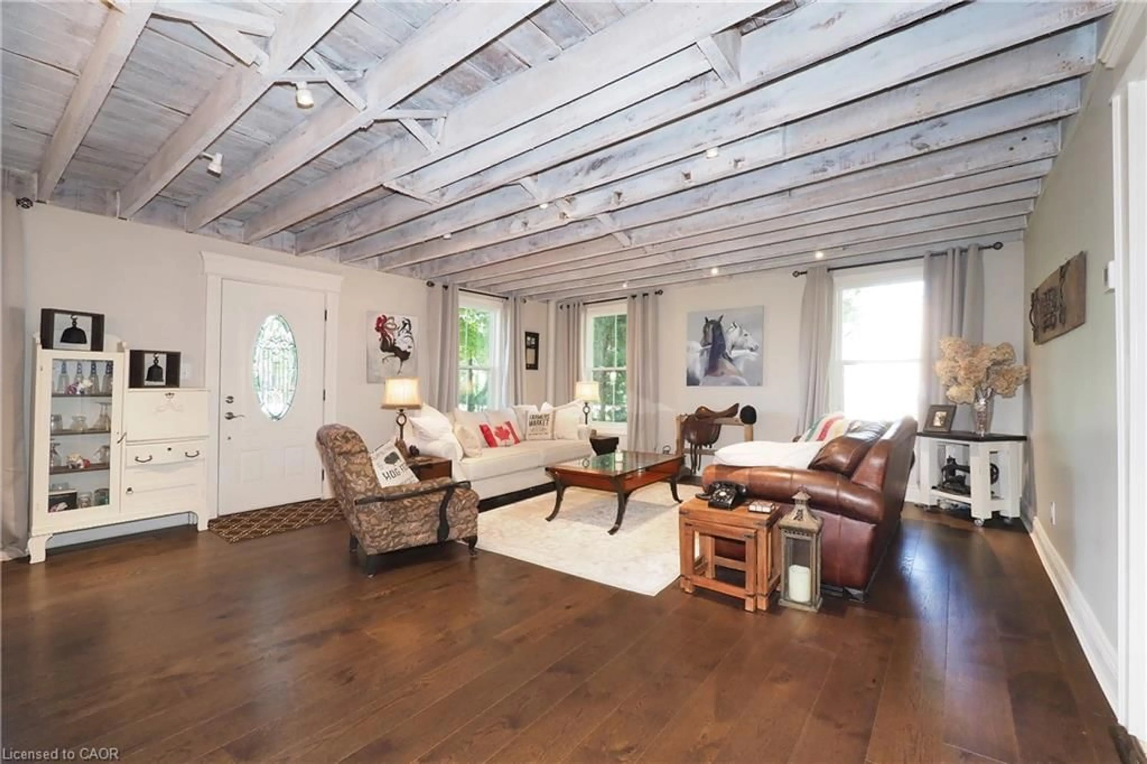 Living room with furniture, wood/laminate floor for 97 Hwy 2, Princeton Ontario N0J 1V0