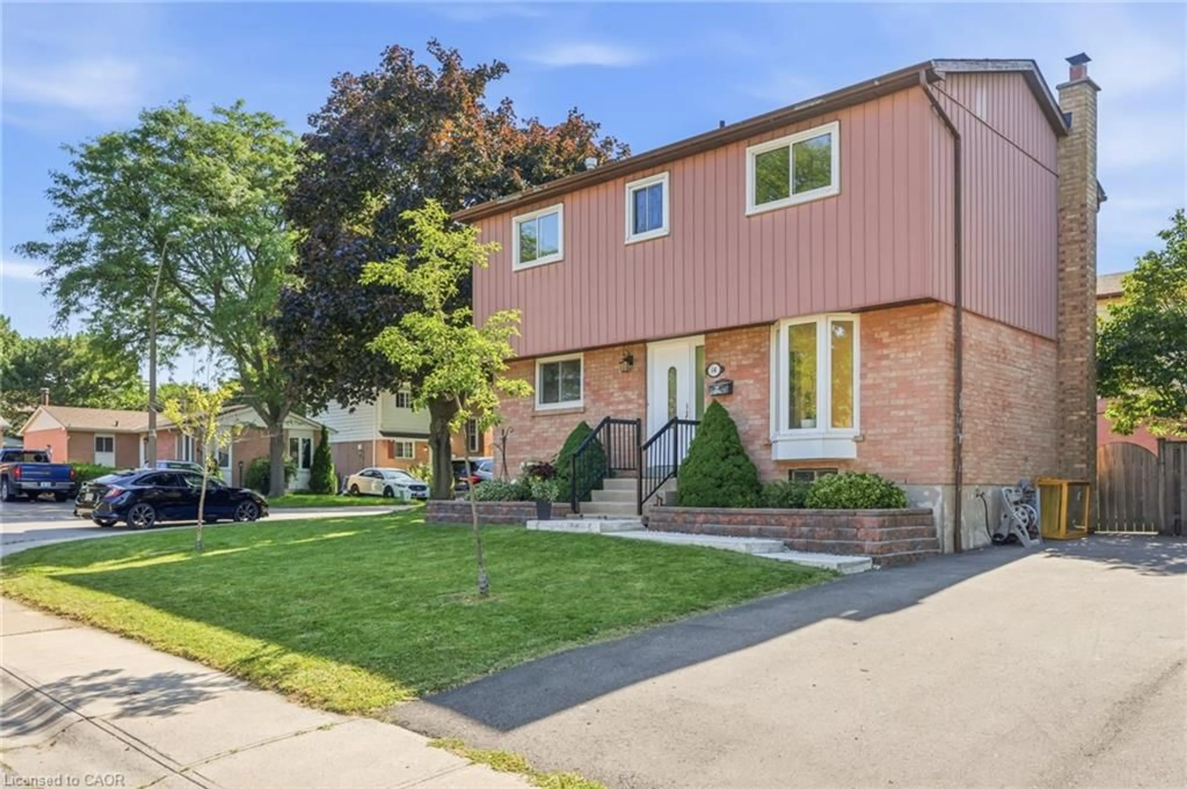 Home with brick exterior material, street for 14 Berrisfield Cres, Hamilton Ontario L4T 4X1