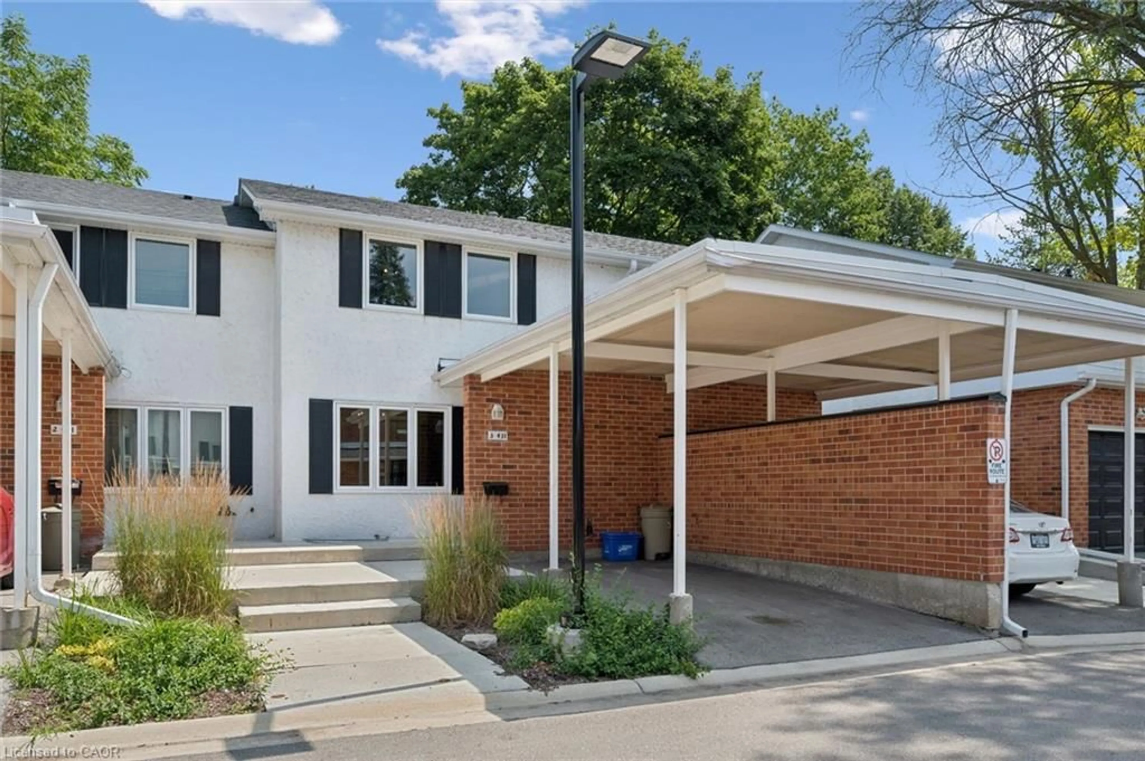 Home with brick exterior material, street for 431 Keats Way #3, Waterloo Ontario N2L 5S7