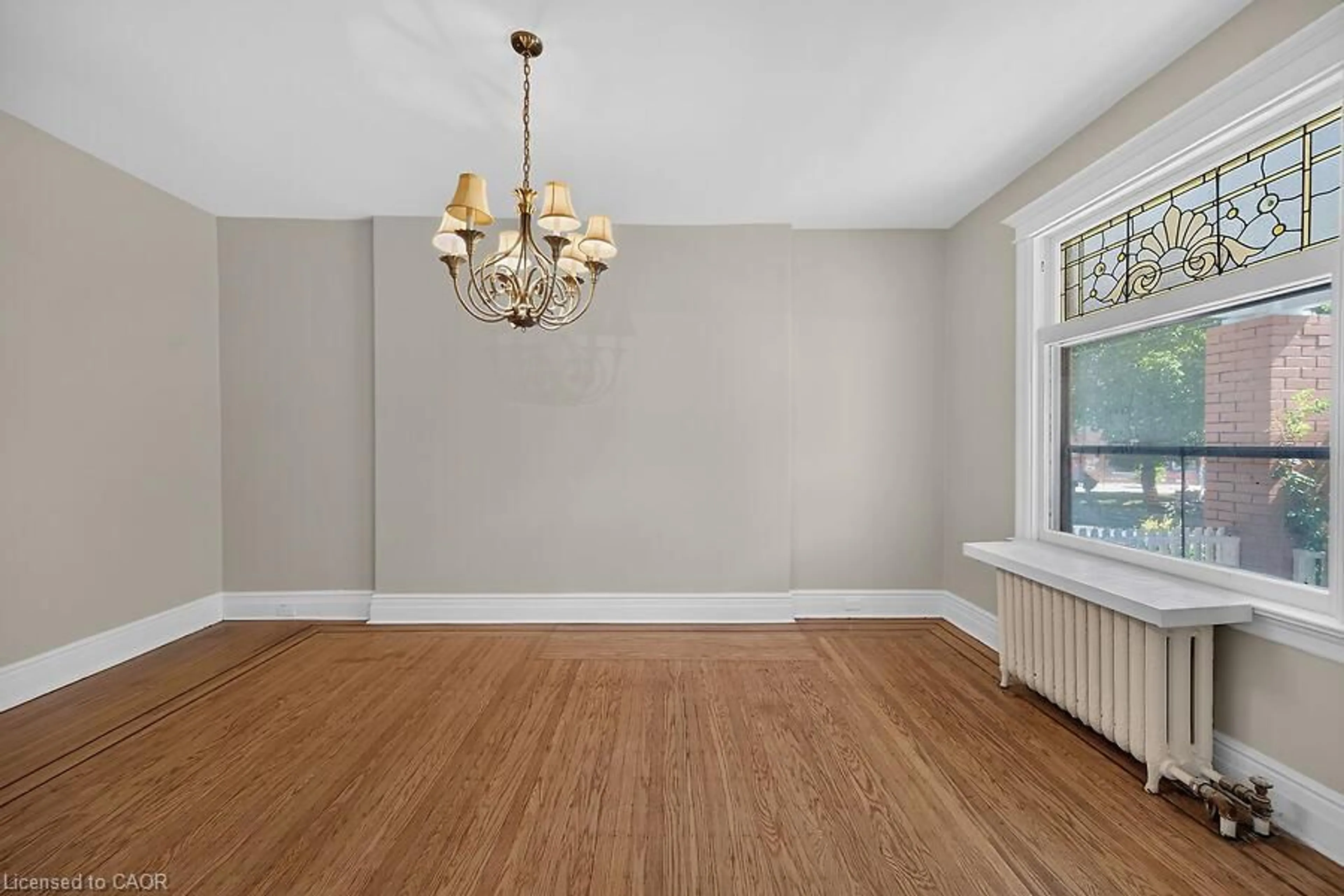 Dining room, wood/laminate floor for 103 Mary St, Hamilton Ontario L8R 1K4