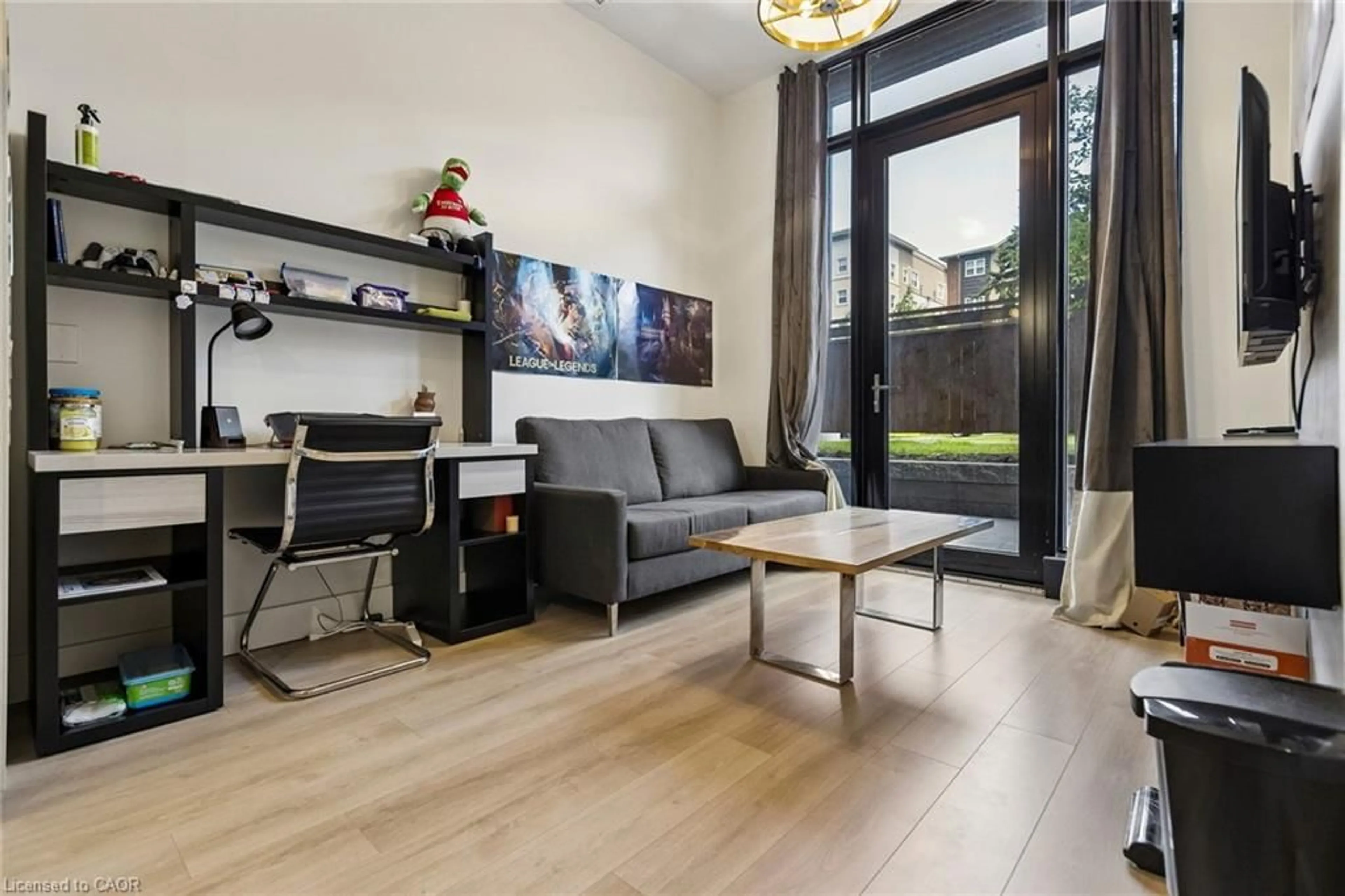 Living room with furniture, wood/laminate floor for 145 Columbia St #131, Waterloo Ontario N2L 0K7