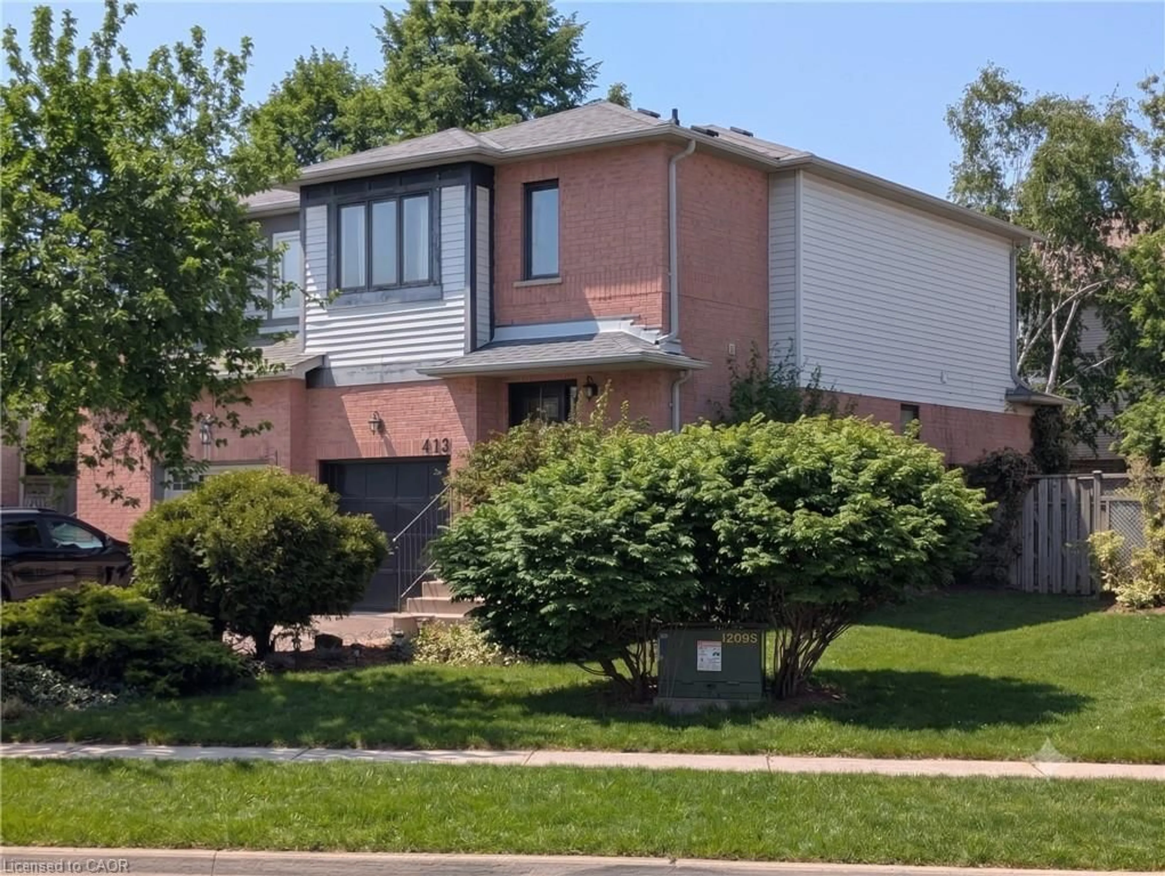 Home with brick exterior material, street for 413 Levanna Lane, Oakville Ontario L6H 6B8