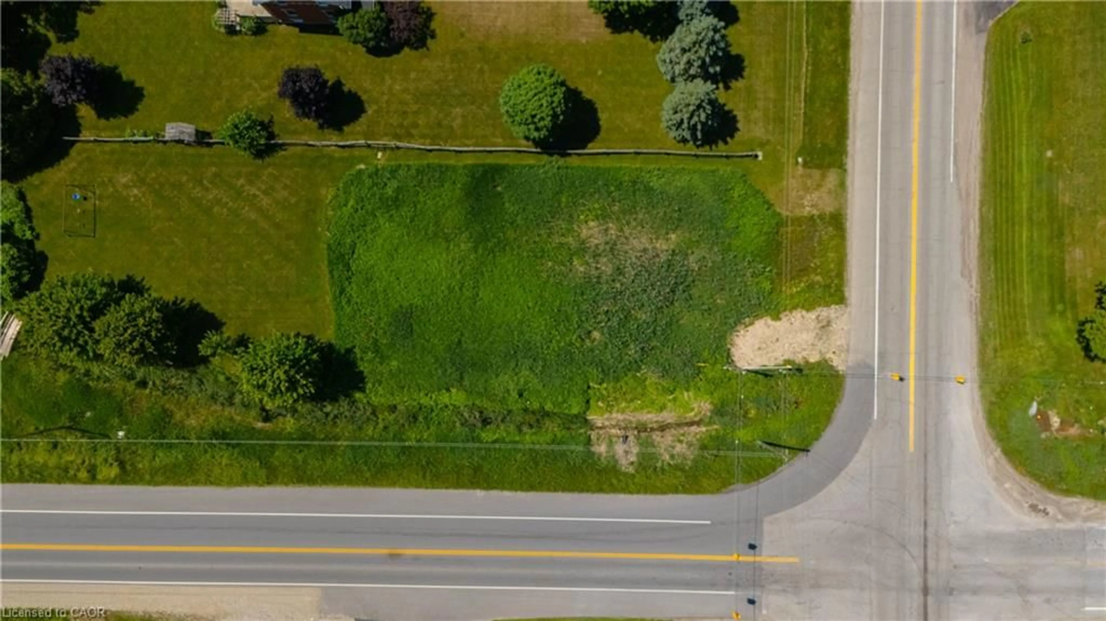 A pic from outside/outdoor area/front of a property/back of a property/a pic from drone, unknown for 7462 Wellington Rd 11, Moorefield Ontario N0G 2K0