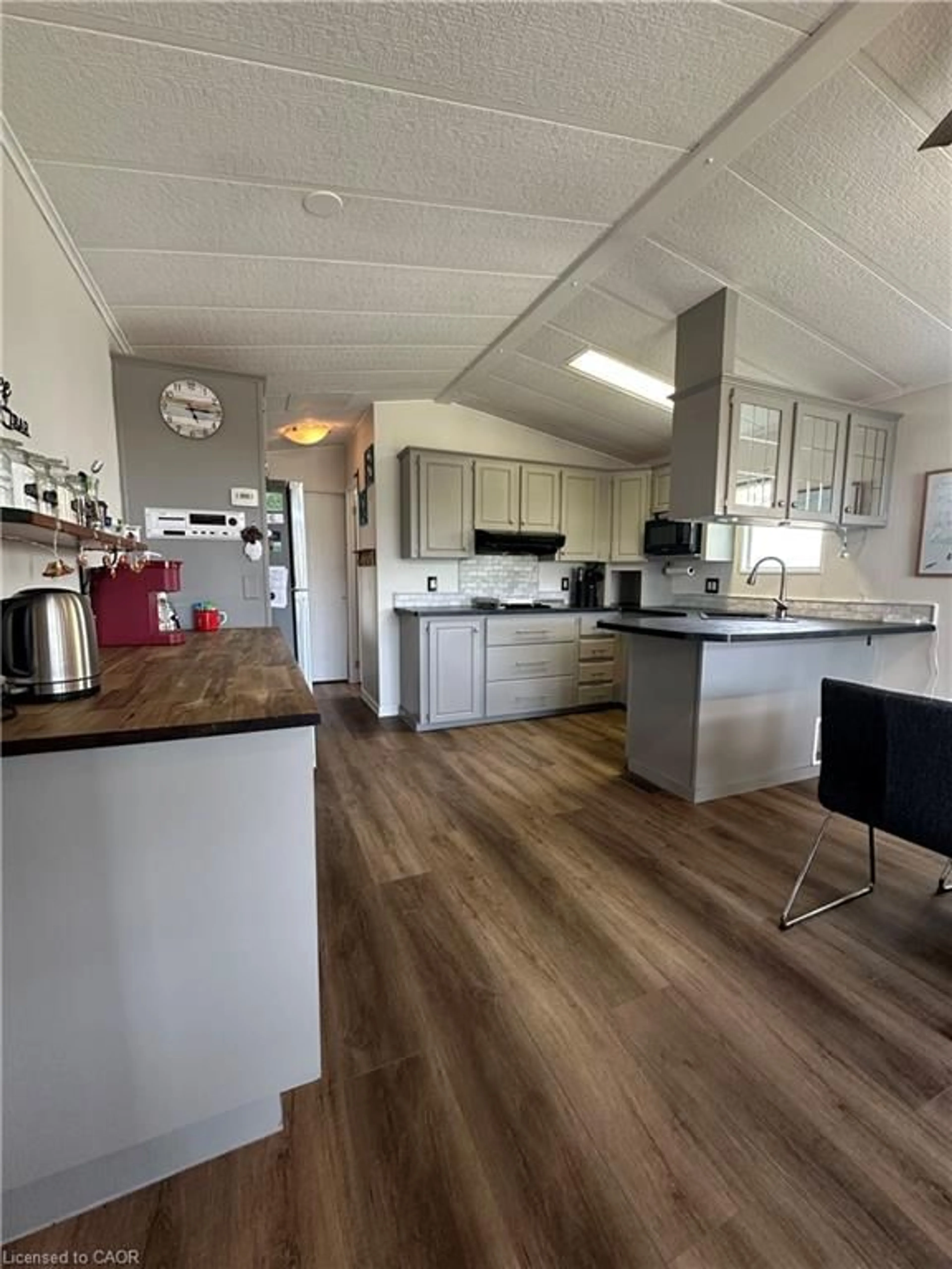 Open concept kitchen, wood/laminate floor for 2325 Victoria Ave #223, Fenwick Ontario L0S 1C0
