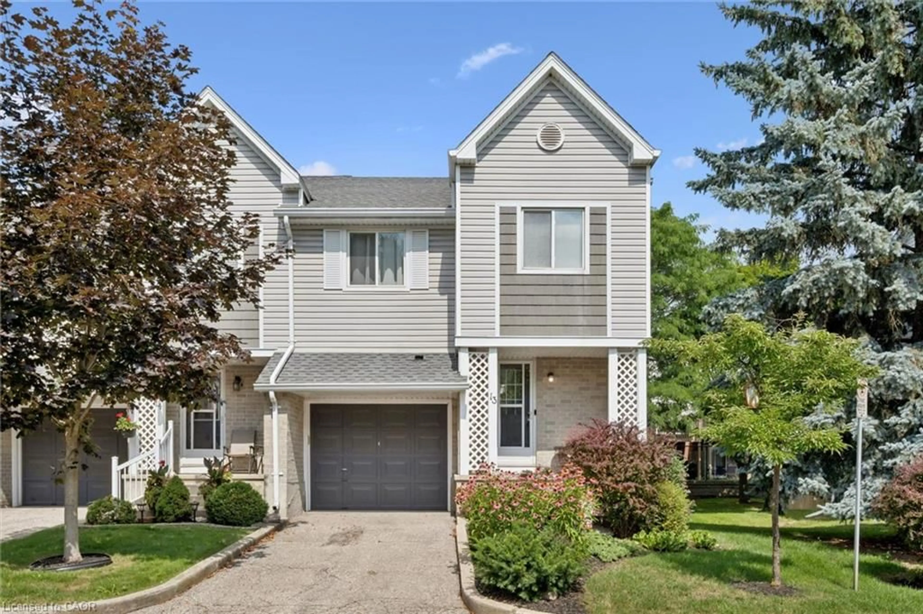 Home with vinyl exterior material, street for 54 Green Valley Dr #13, Kitchener Ontario N2P 1Z9