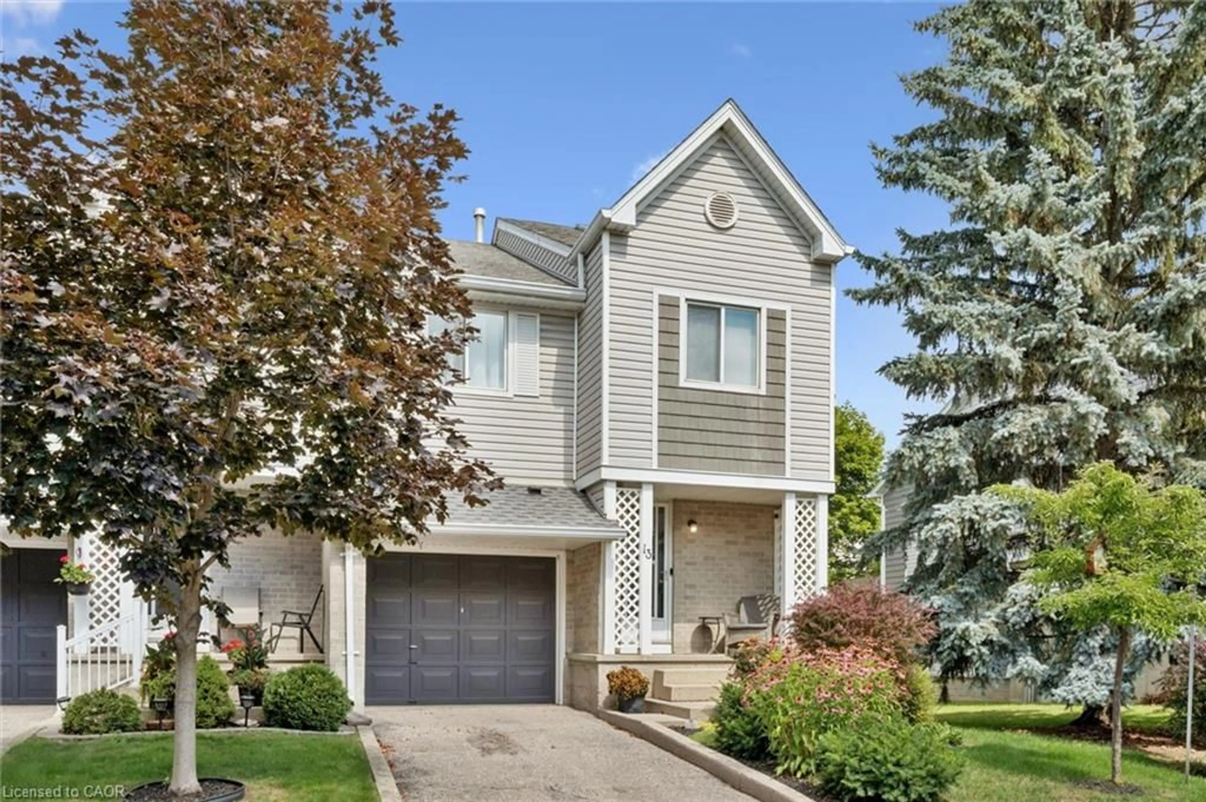 Home with vinyl exterior material, street for 54 Green Valley Dr #13, Kitchener Ontario N2P 1Z9