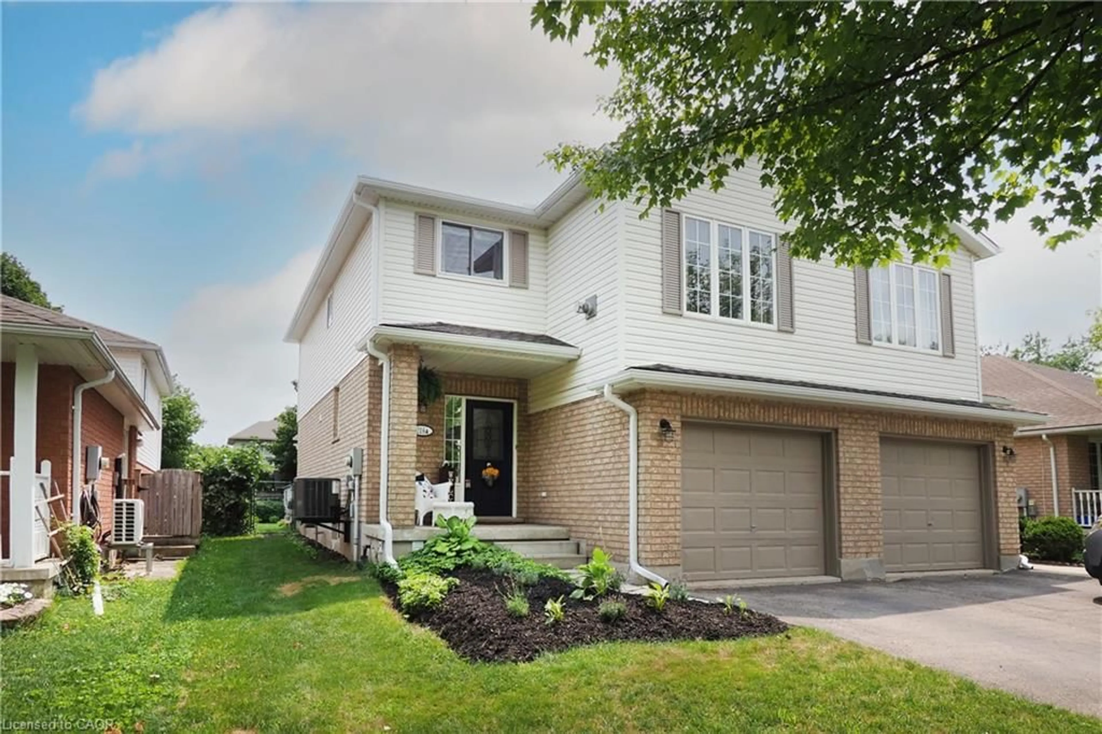 Home with brick exterior material, street for 218 Inverhuron Cres #A, Waterloo Ontario N2V 2H7