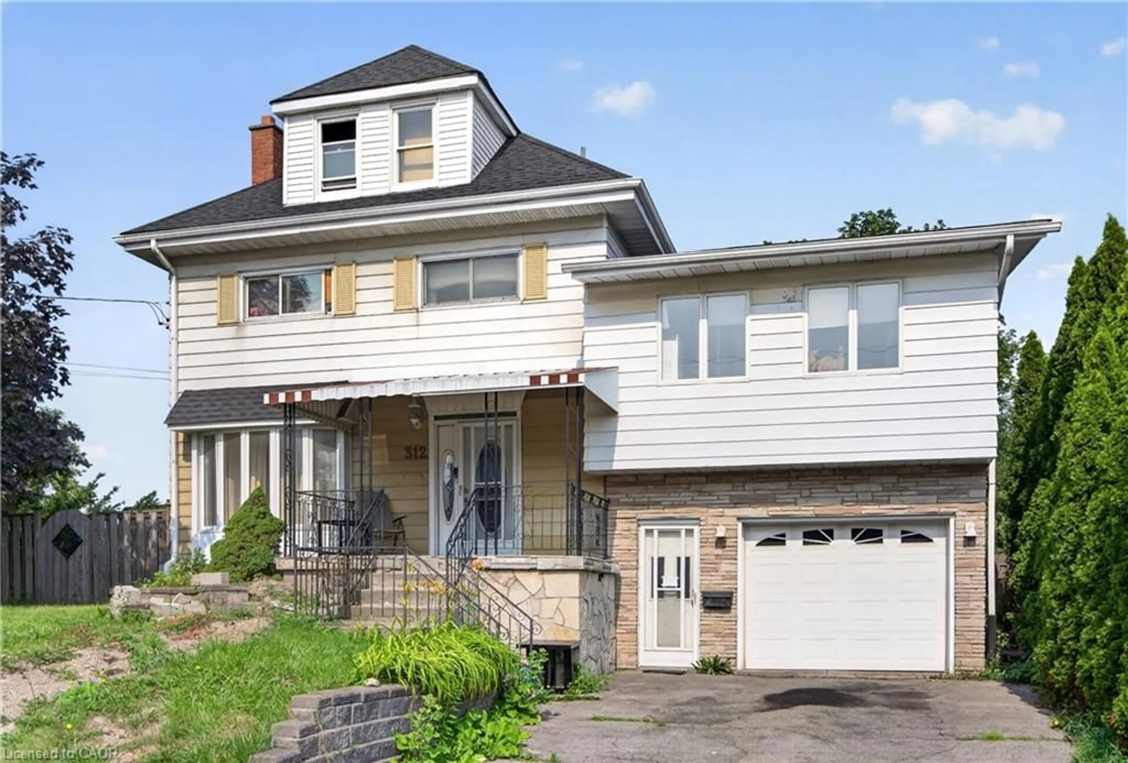 Home with vinyl exterior material, street for 312 East 12th St, Hamilton Ontario L9A 3Y1
