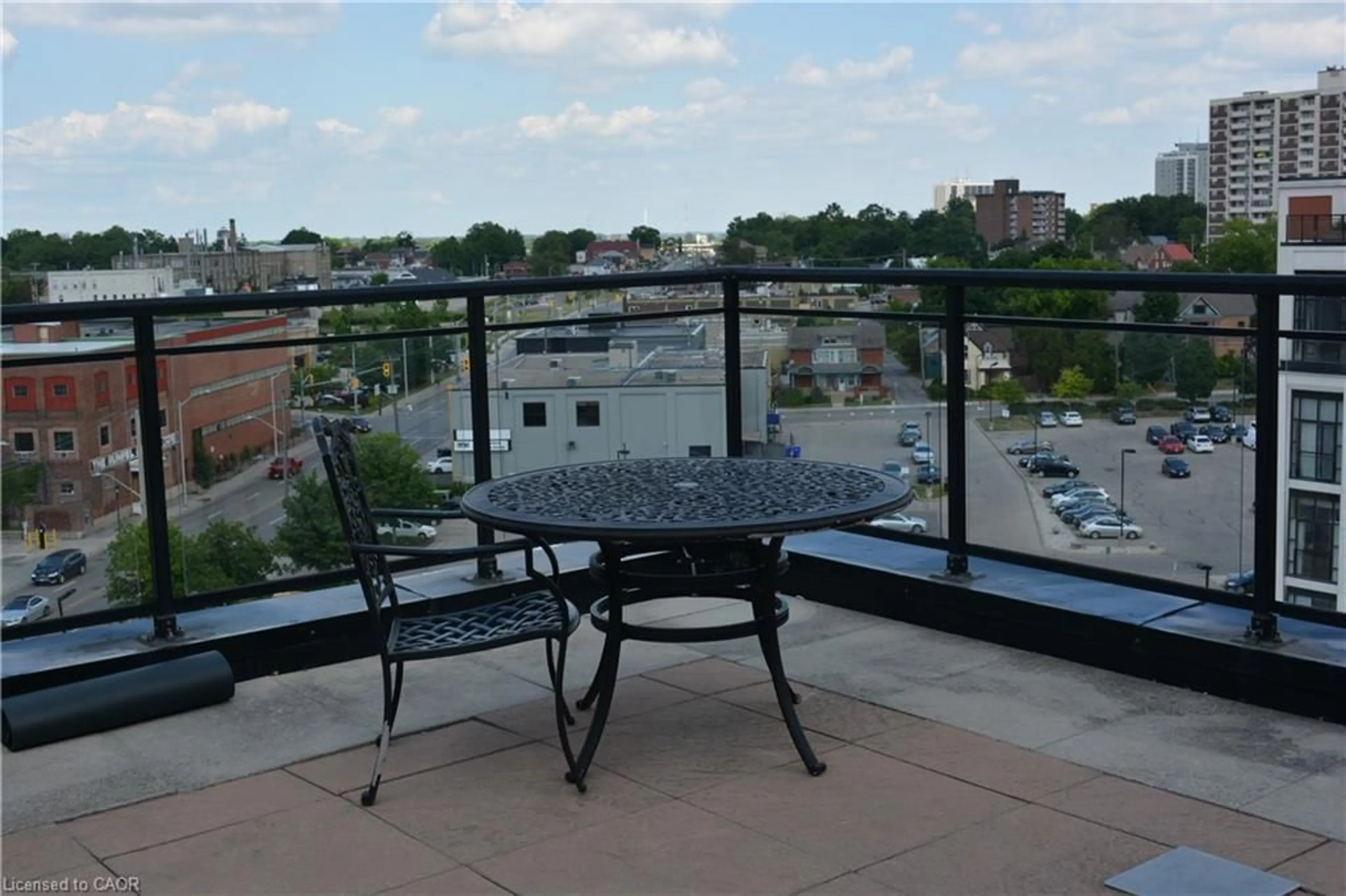 Patio, city buildings view from balcony for 410 King St #203, Kitchener Ontario N2G 1C3