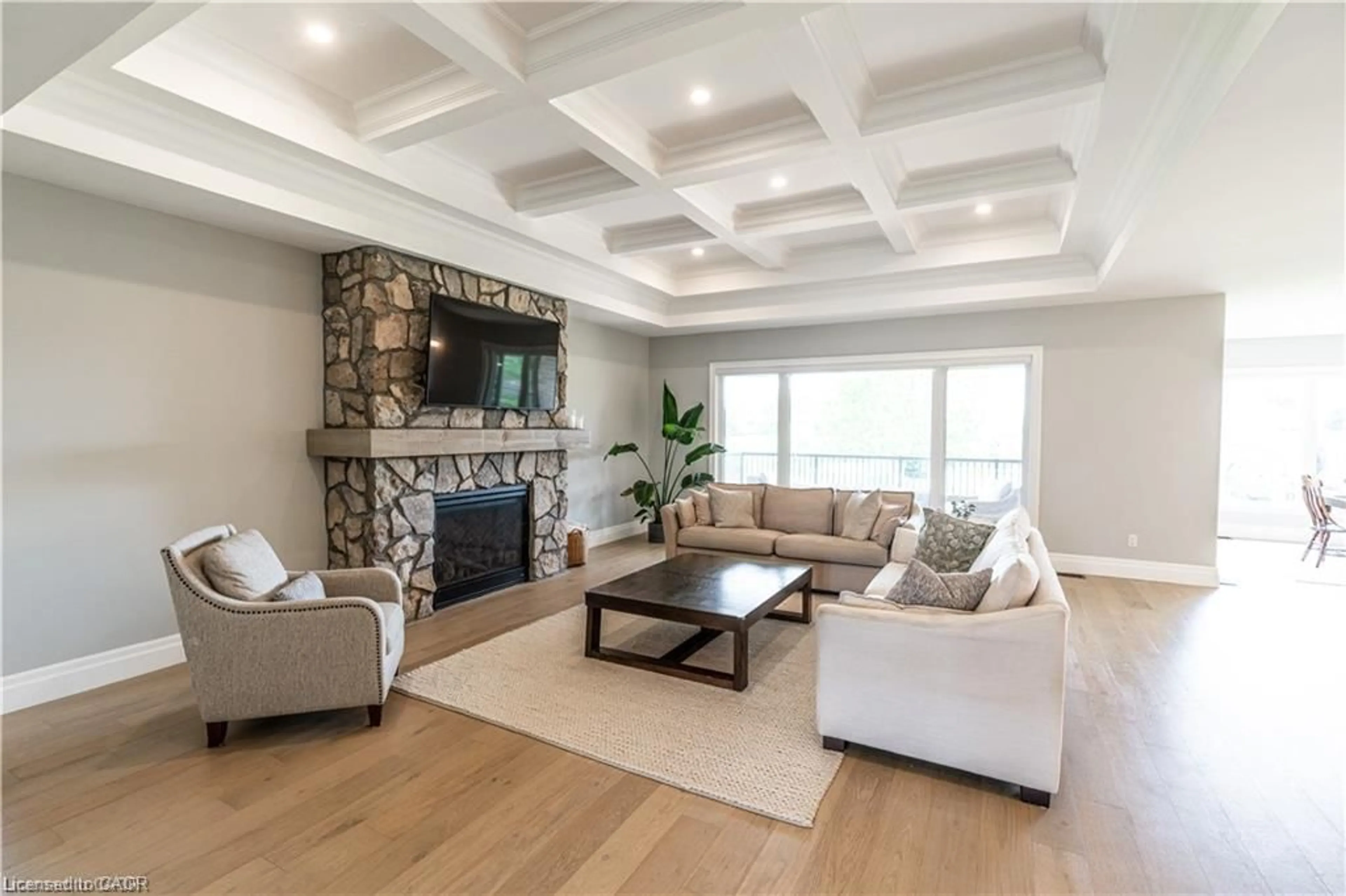 Living room with furniture, wood/laminate floor for 21 Hudson Dr, Brantford Ontario N3T 0V6