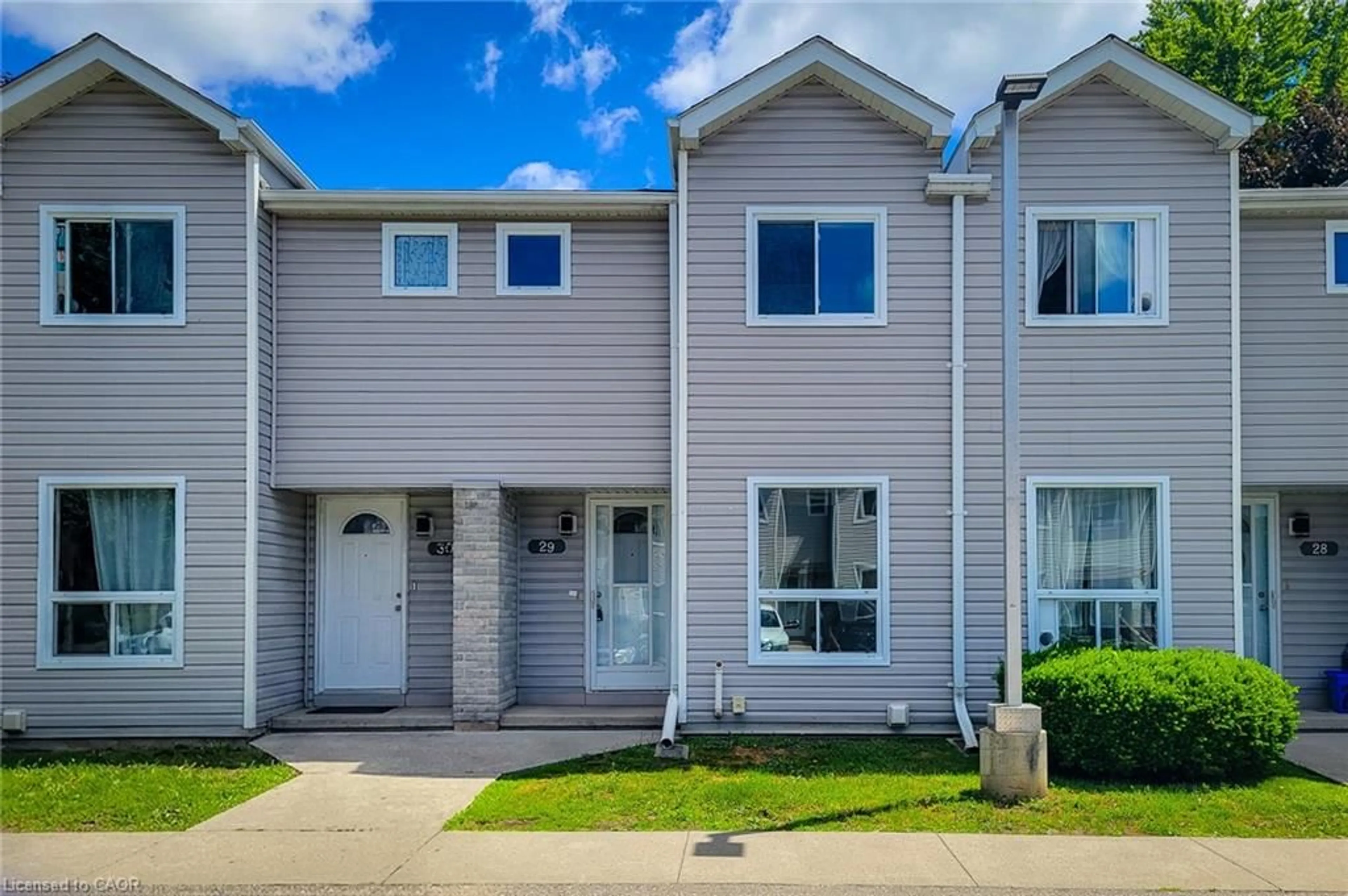 Home with vinyl exterior material, street for 488 Grey St #29, Brantford Ontario N3S 7S6