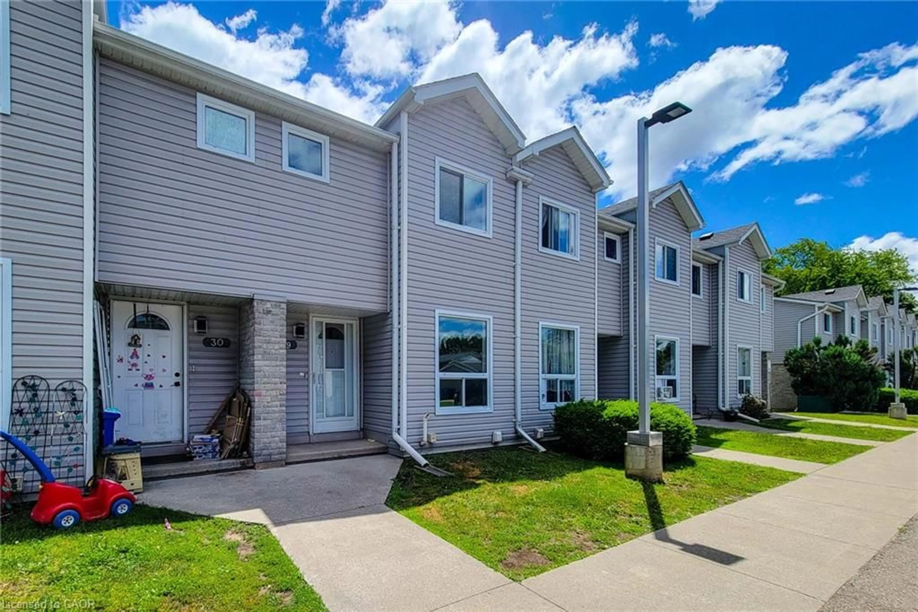 Home with vinyl exterior material, street for 488 Grey St #29, Brantford Ontario N3S 7S6