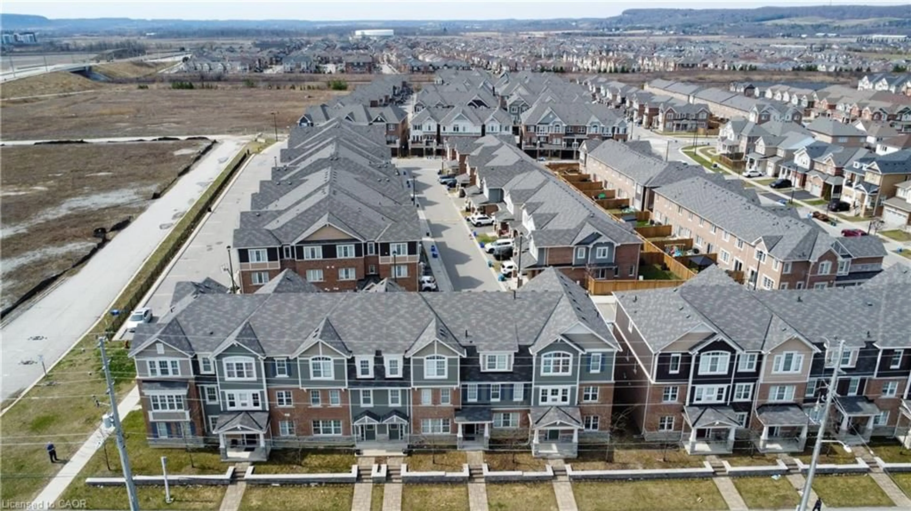 A pic from outside/outdoor area/front of a property/back of a property/a pic from drone, city buildings view from balcony for 1000 Asleton Blvd #164, Milton Ontario L9T 9L3