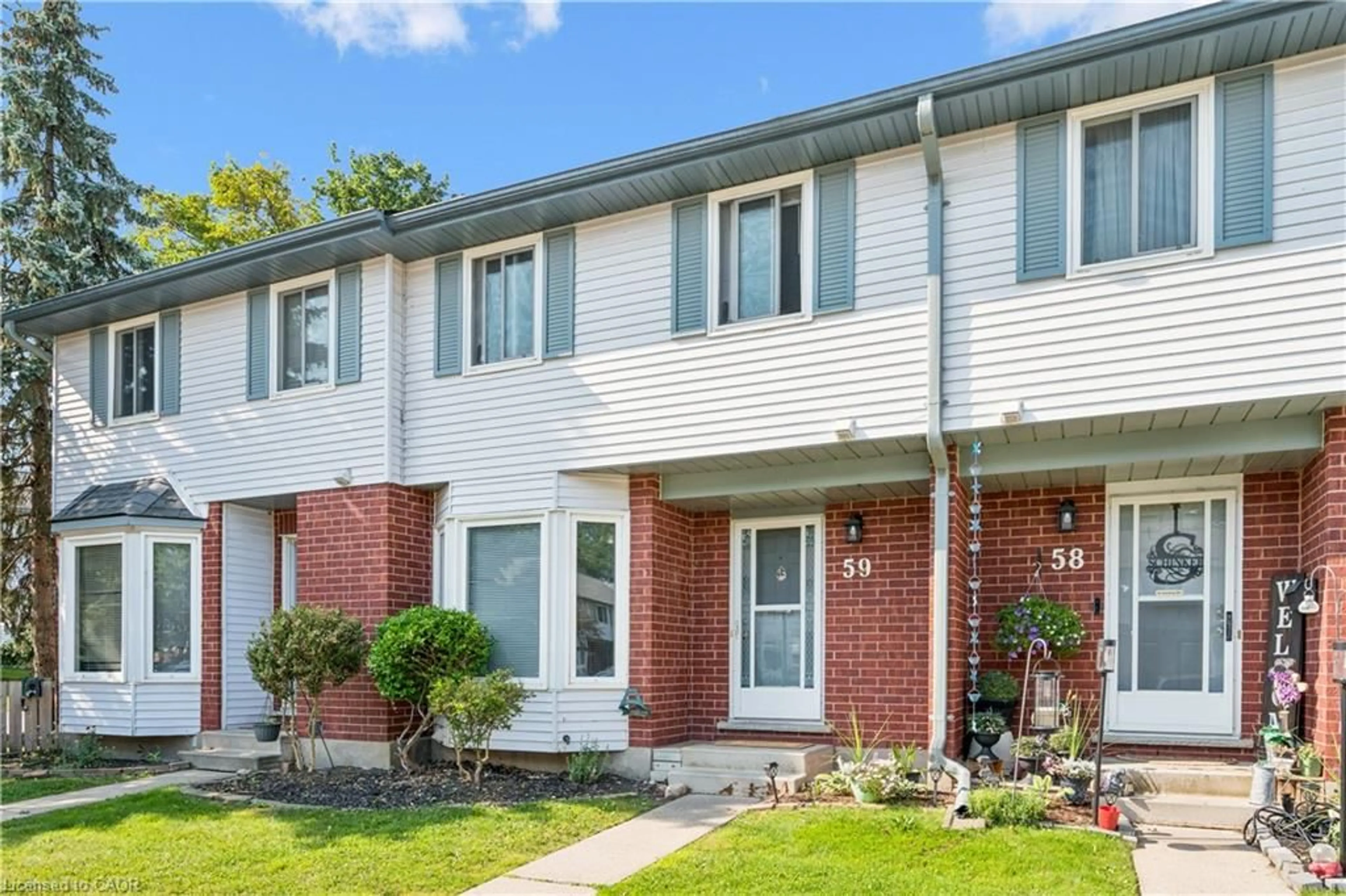 Home with brick exterior material, street for 219 Kingswood Dr #59, Kitchener Ontario N2E 3J4