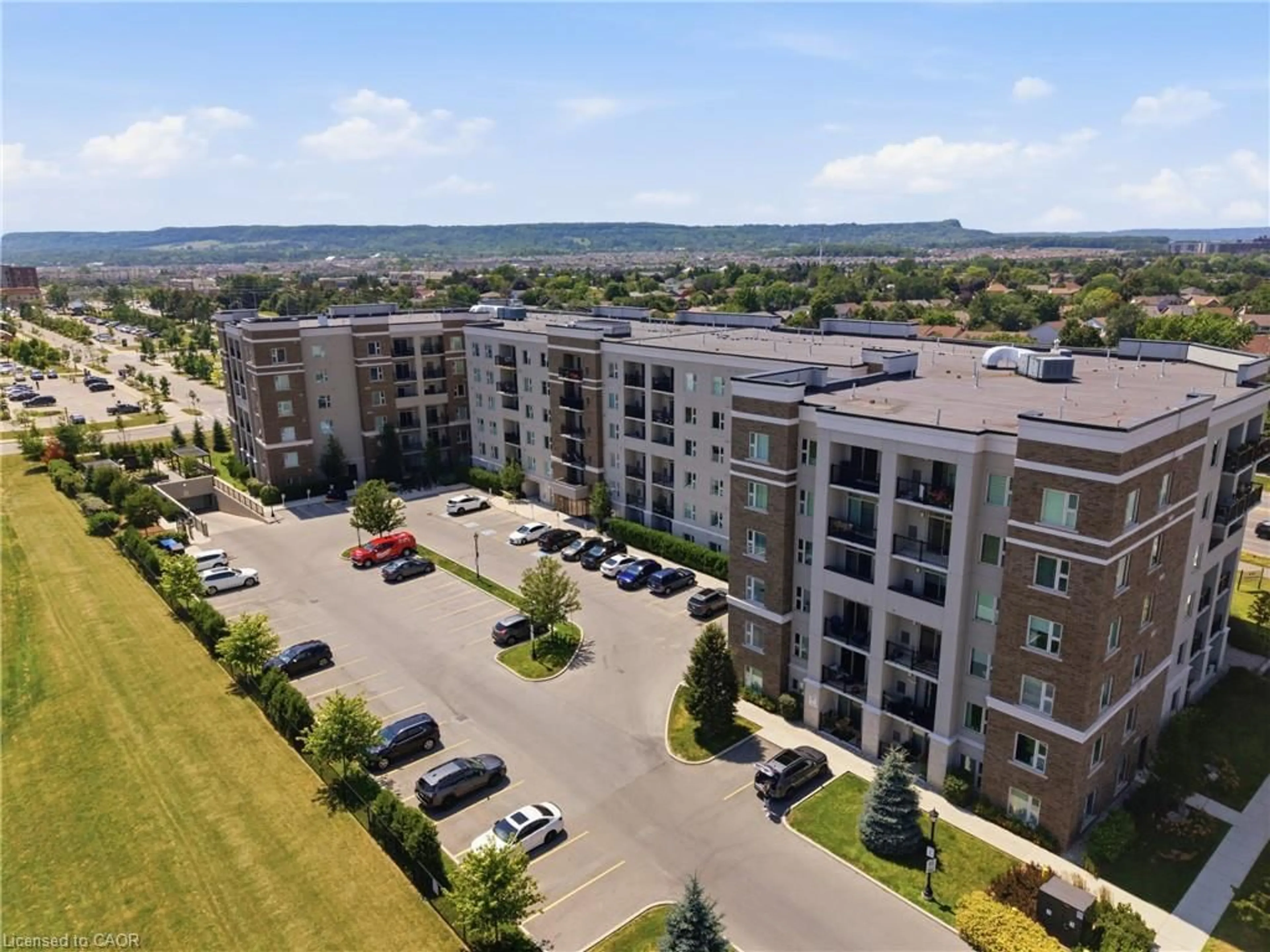A pic from outside/outdoor area/front of a property/back of a property/a pic from drone, unknown for 610 Farmstead Dr #126, Milton Ontario L9T 8X5