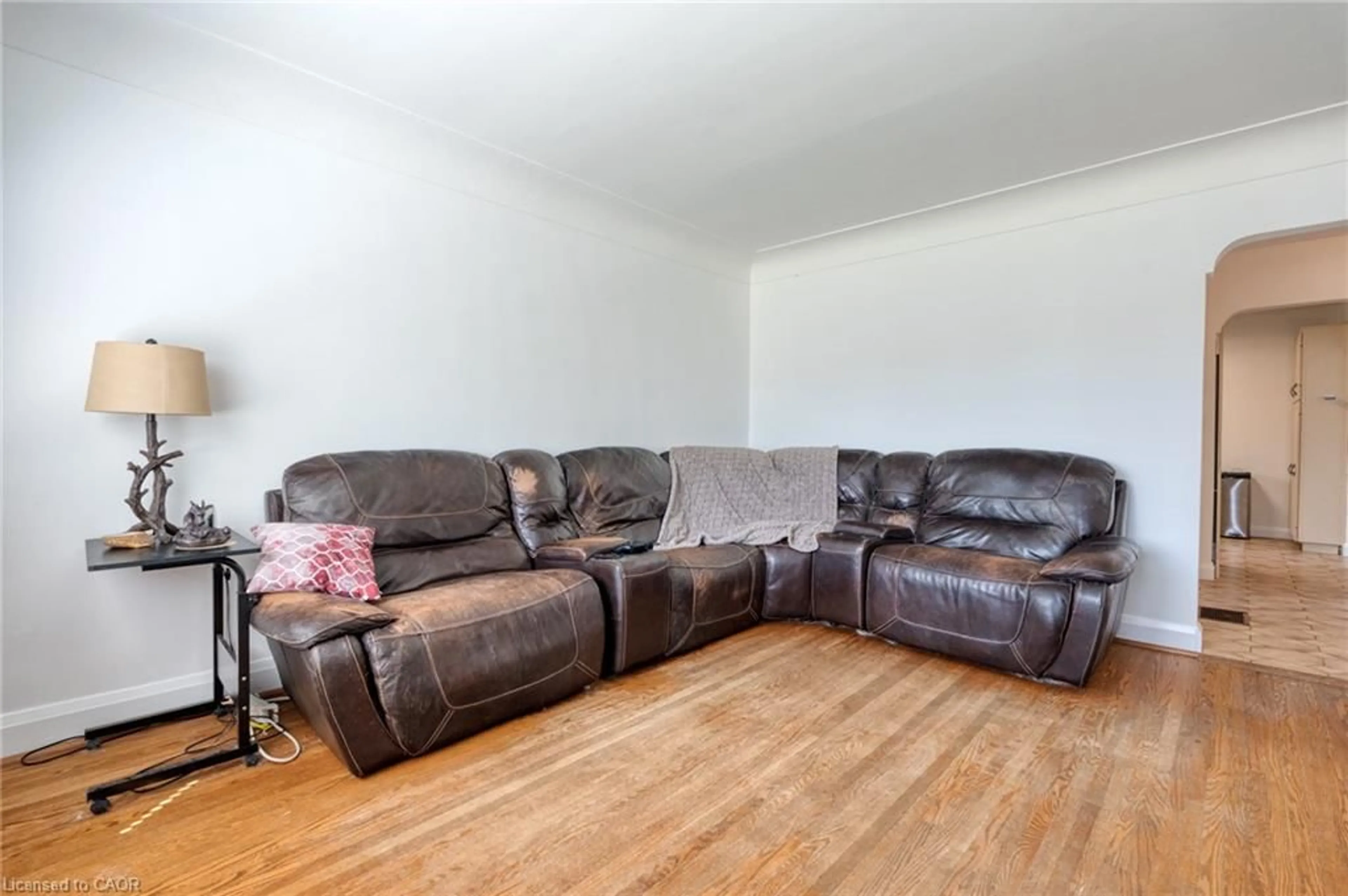 Living room with furniture, wood/laminate floor for 27 Delevan Cres, Hamilton Ontario L9A 4A8