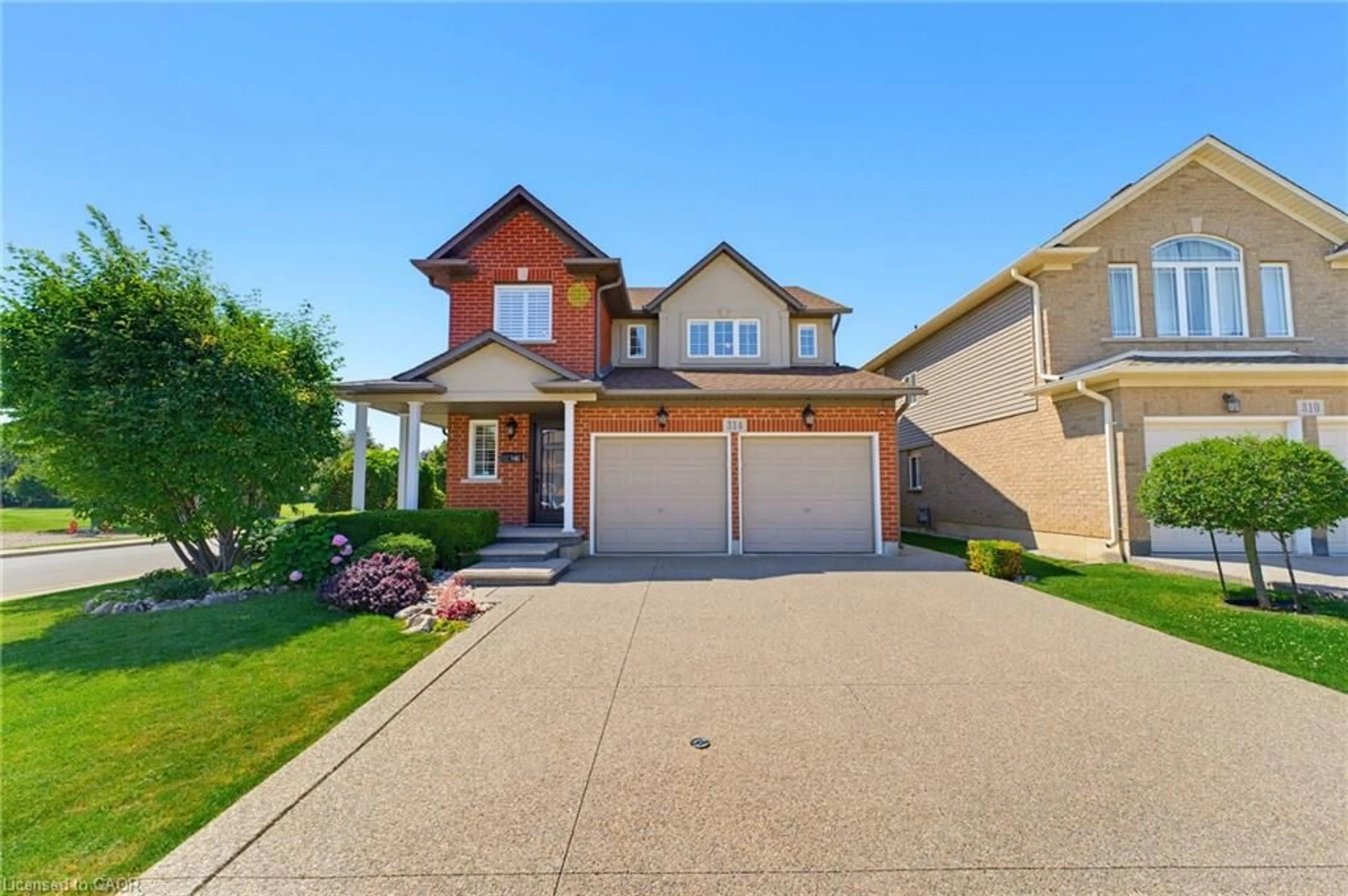 Home with brick exterior material, street for 314 Brigadoon Dr, Hamilton Ontario L9C 0B7