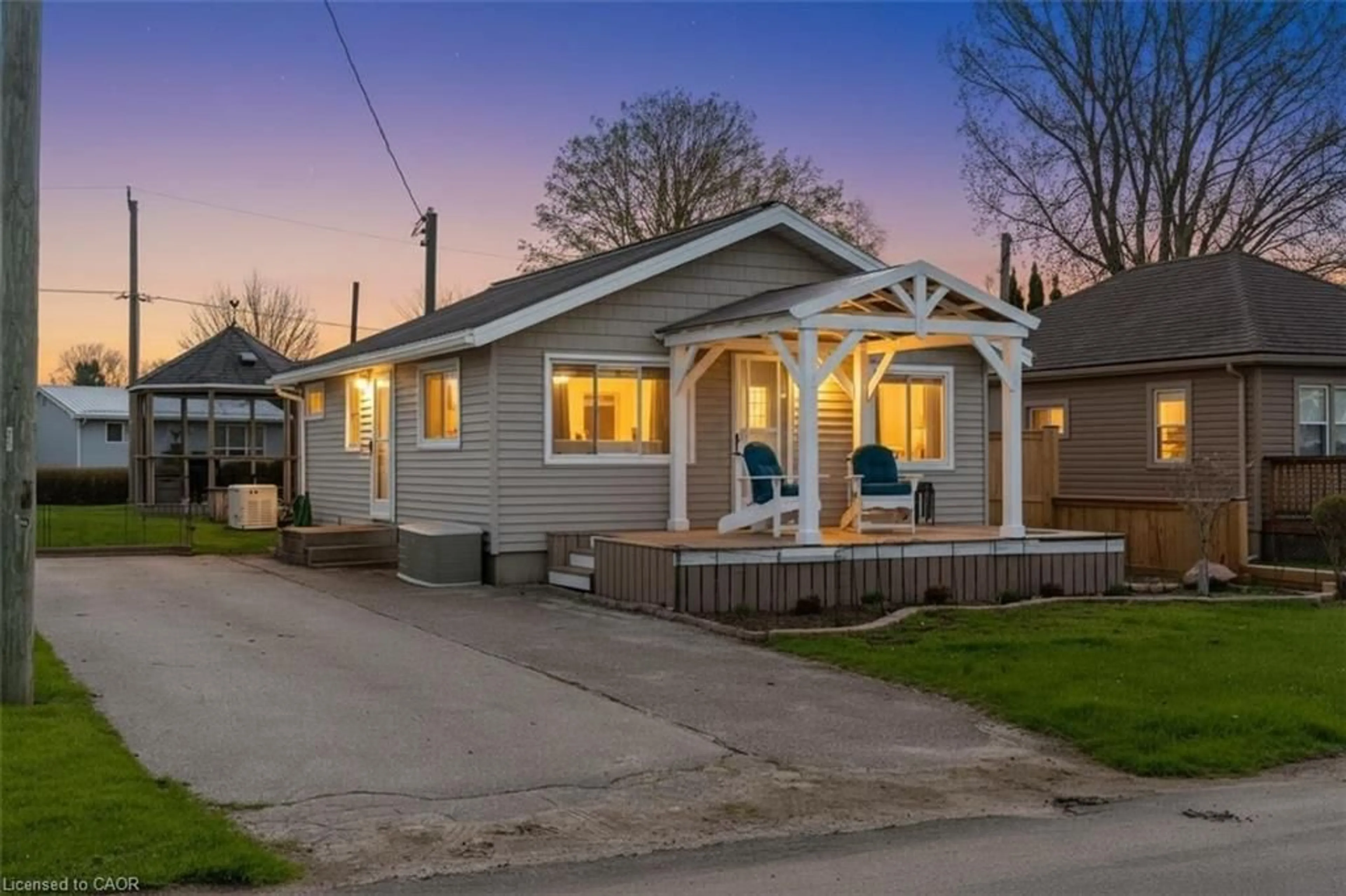 Home with vinyl exterior material, street for 21 Fourth Ave, Long Point Ontario N0E 1M0