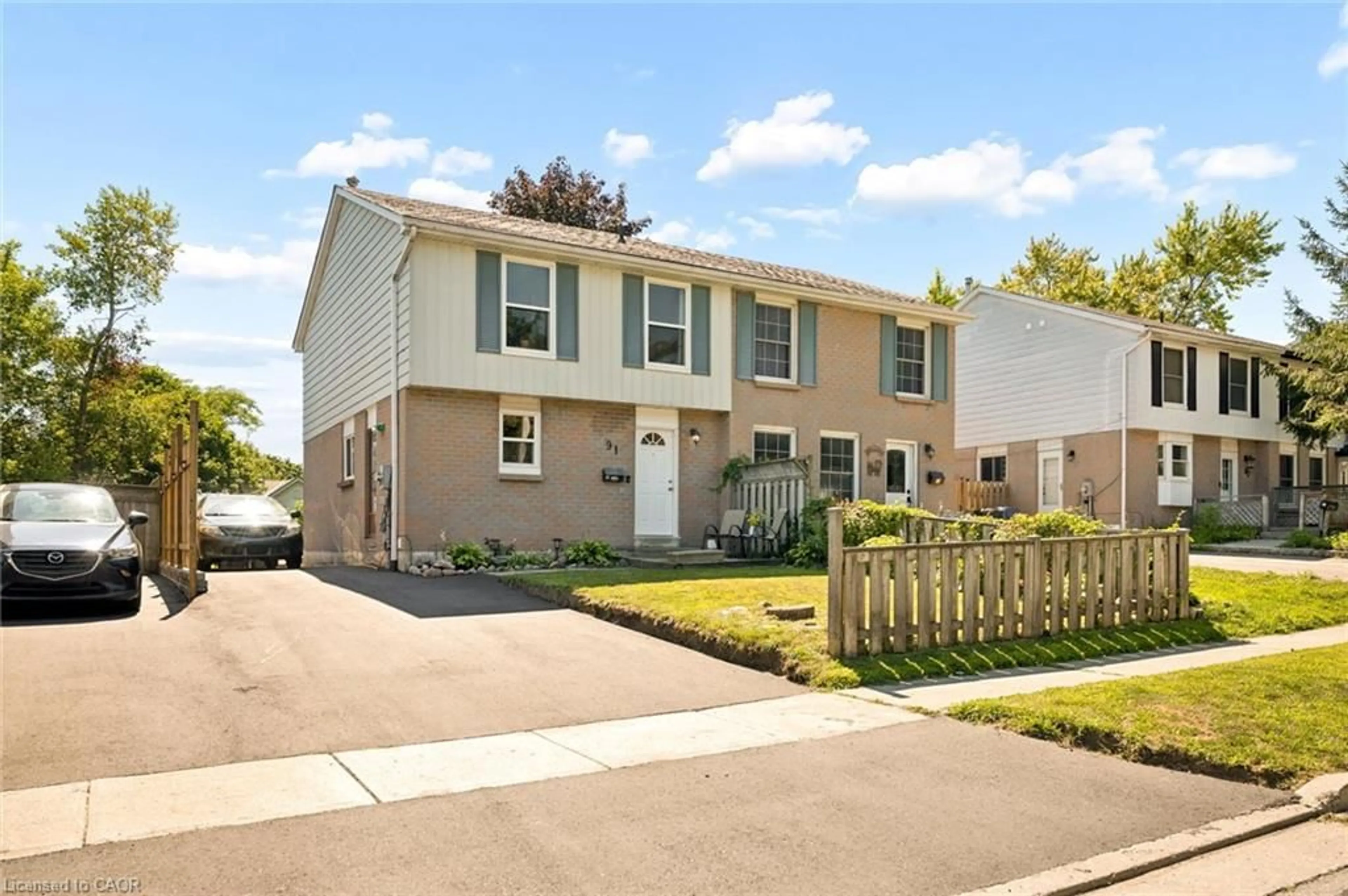 Home with vinyl exterior material, street for 91 Hadati Rd, Guelph Ontario N1E 6G9