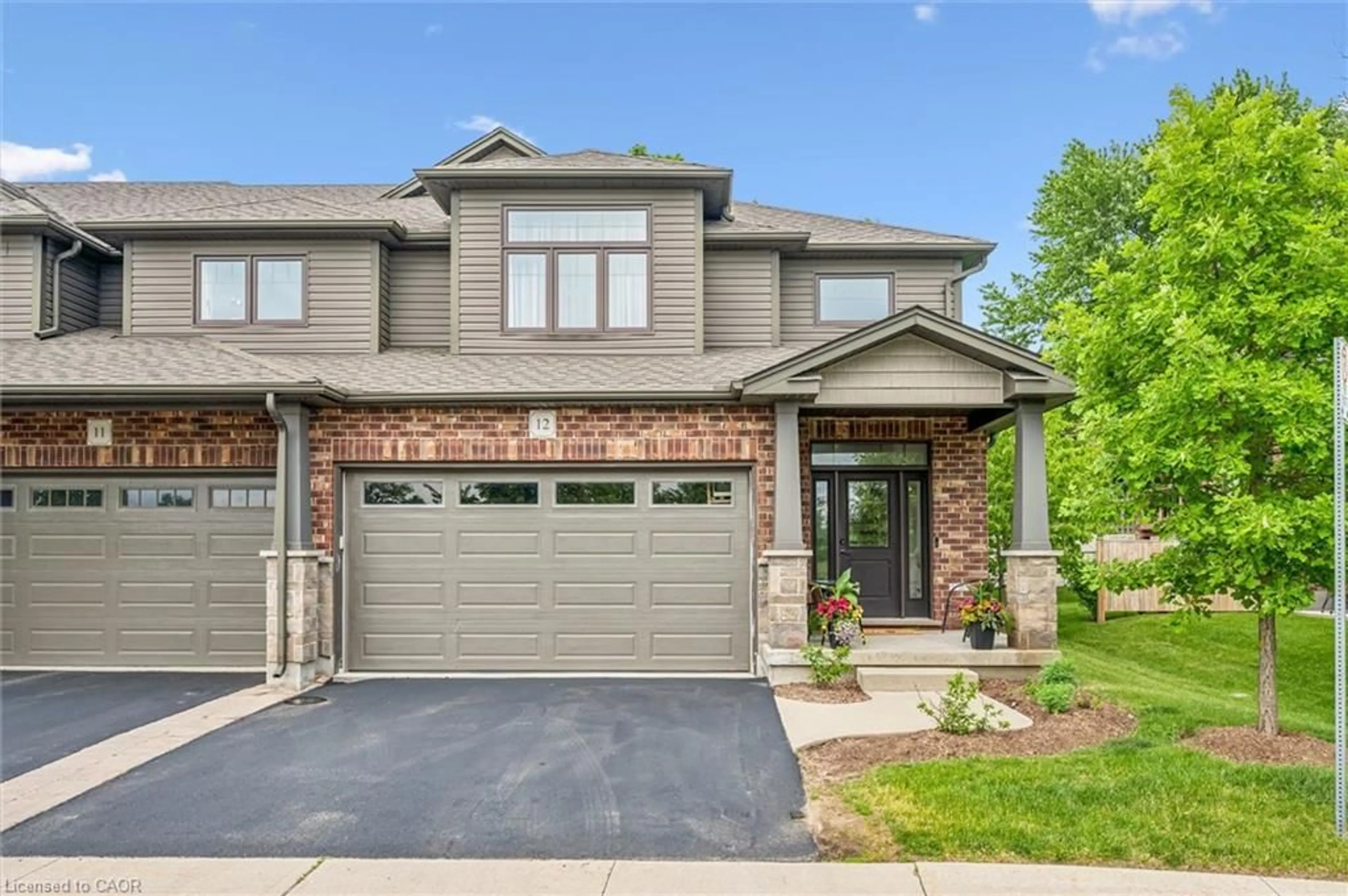 Home with brick exterior material, street for 254 Gosling Gardens #12, Guelph Ontario N1L 0M4