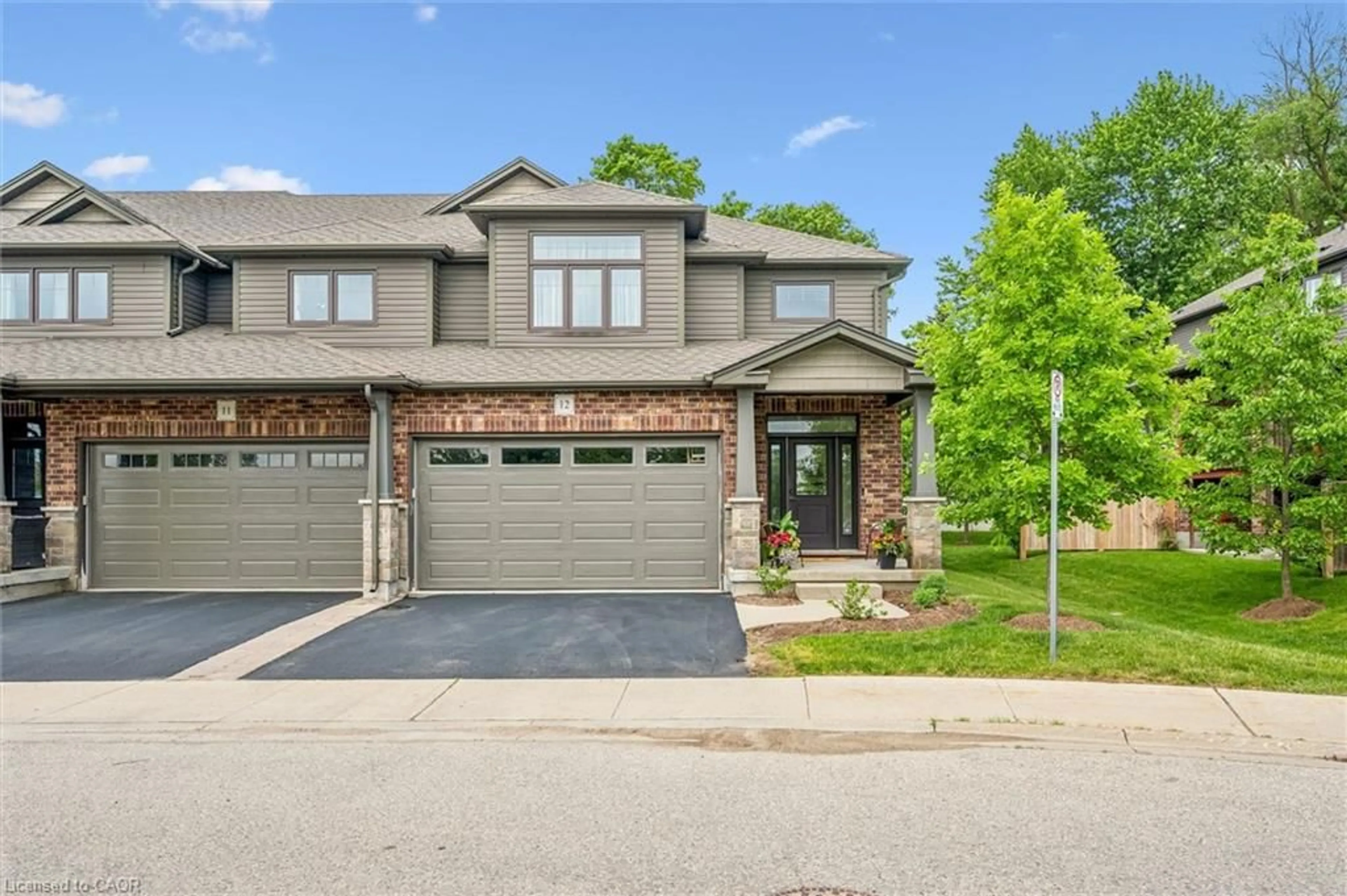 Home with brick exterior material, street for 254 Gosling Gardens #12, Guelph Ontario N1L 0M4