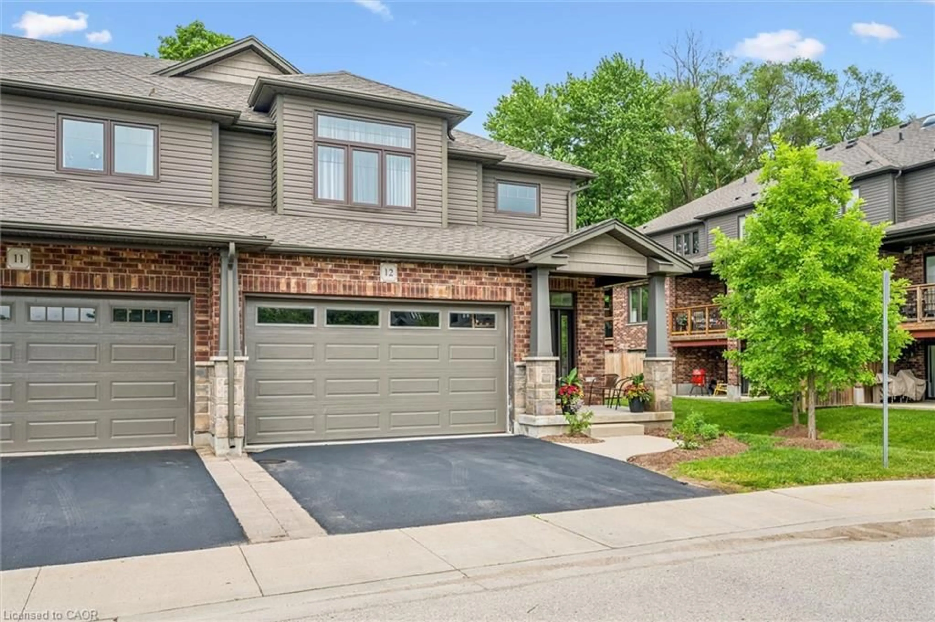 Home with brick exterior material, street for 254 Gosling Gardens #12, Guelph Ontario N1L 0M4