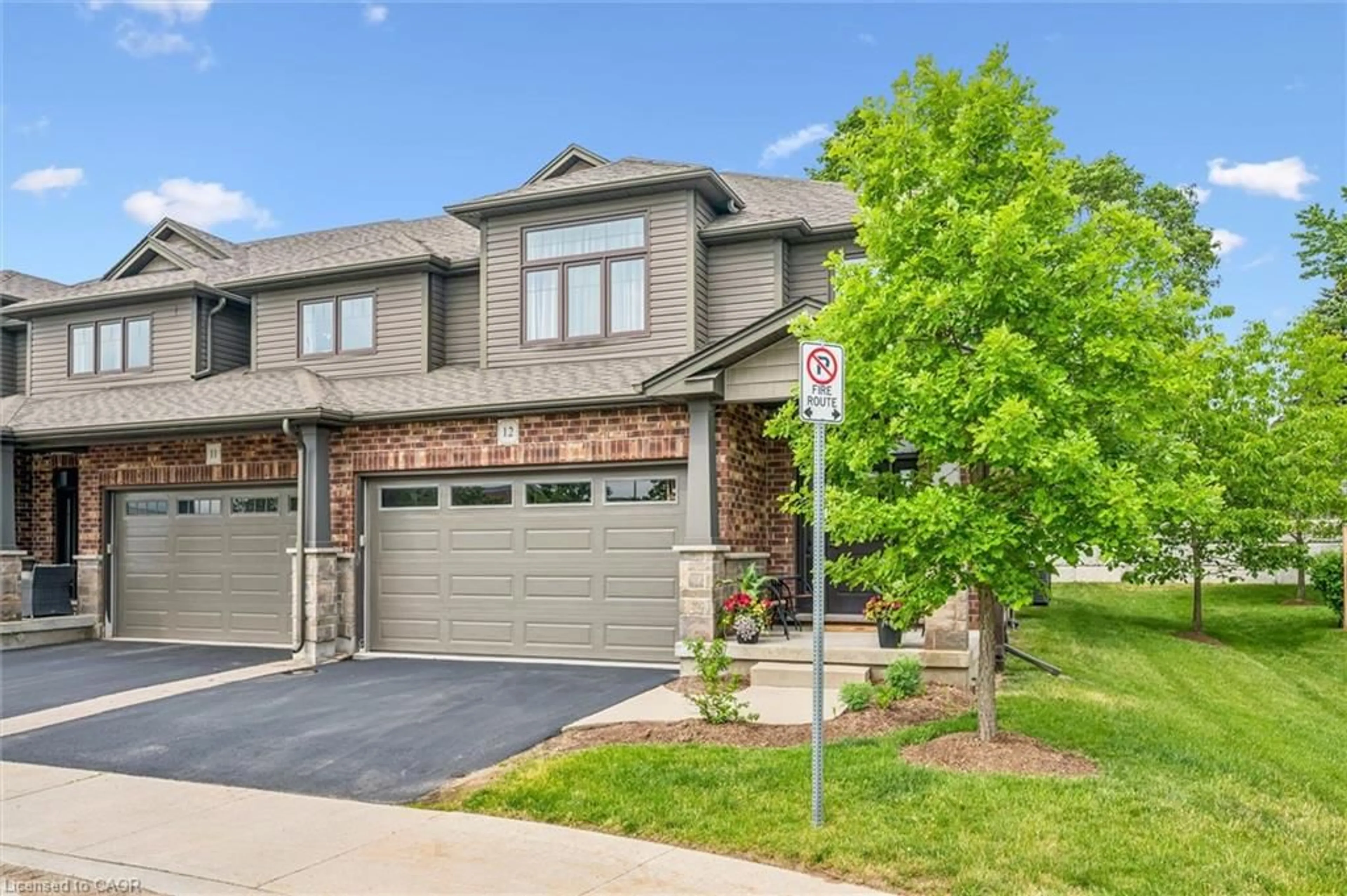 Home with brick exterior material, street for 254 Gosling Gardens #12, Guelph Ontario N1L 0M4