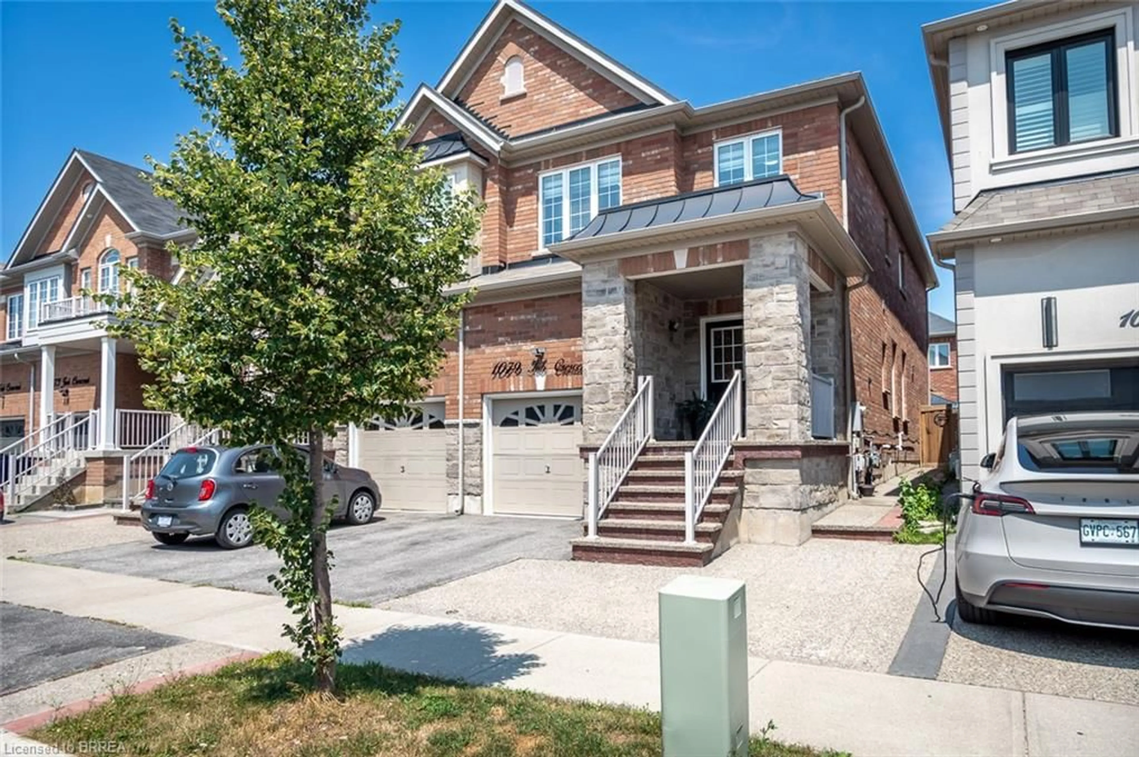 Home with brick exterior material, street for 1079 Job Cres, Milton Ontario L9T 8V5