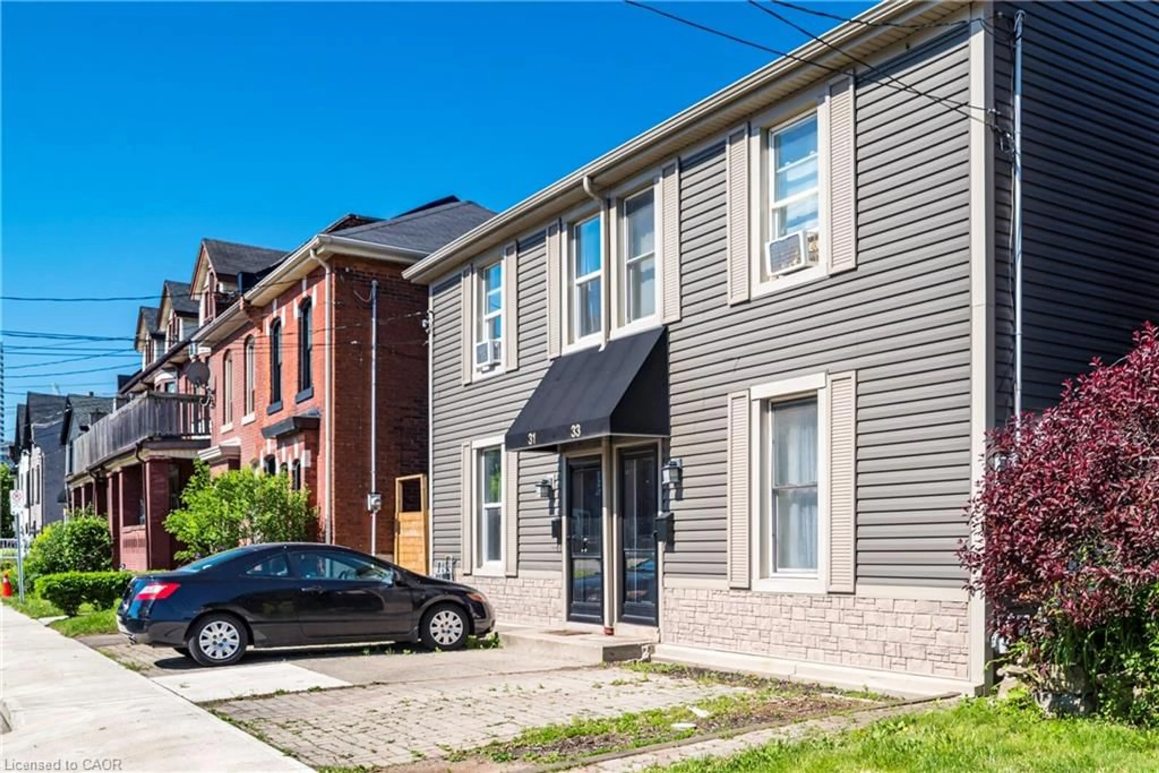 Home with brick exterior material, street for 33 Railway St, Hamilton Ontario L8R 2R4
