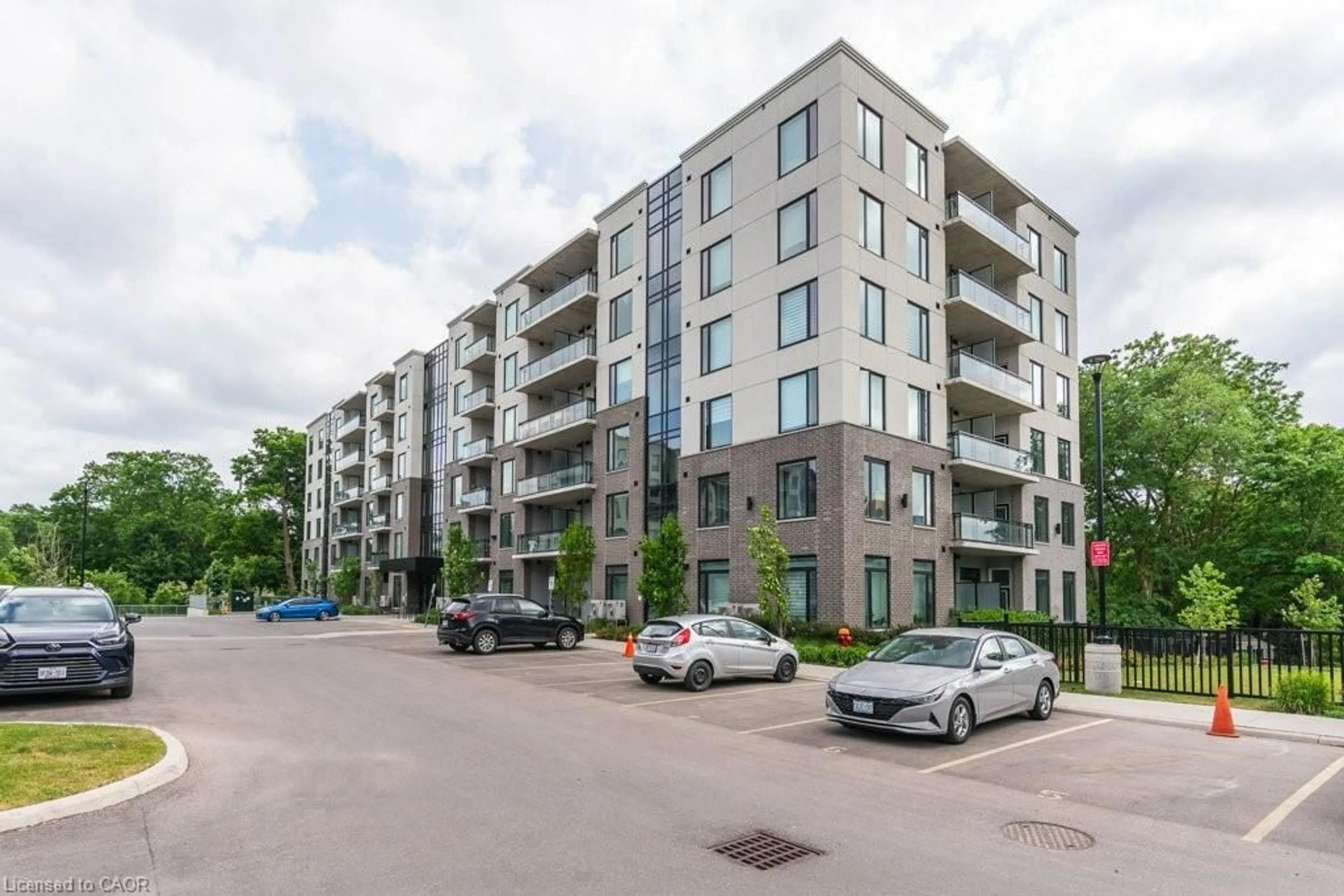 A pic from outside/outdoor area/front of a property/back of a property/a pic from drone, street for 103 Roger St #102, Waterloo Ontario N2J 0G2