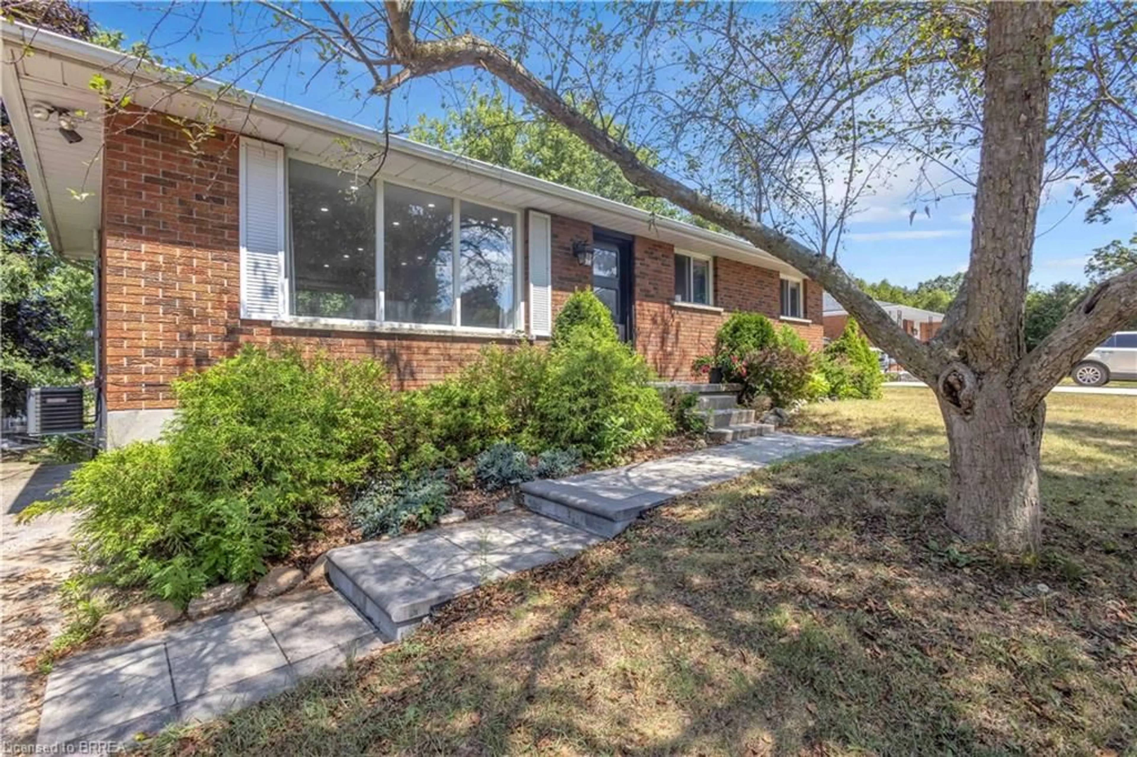 Home with brick exterior material, street for 30 Ridgeway Ave, Simcoe Ontario N3Y 4J9