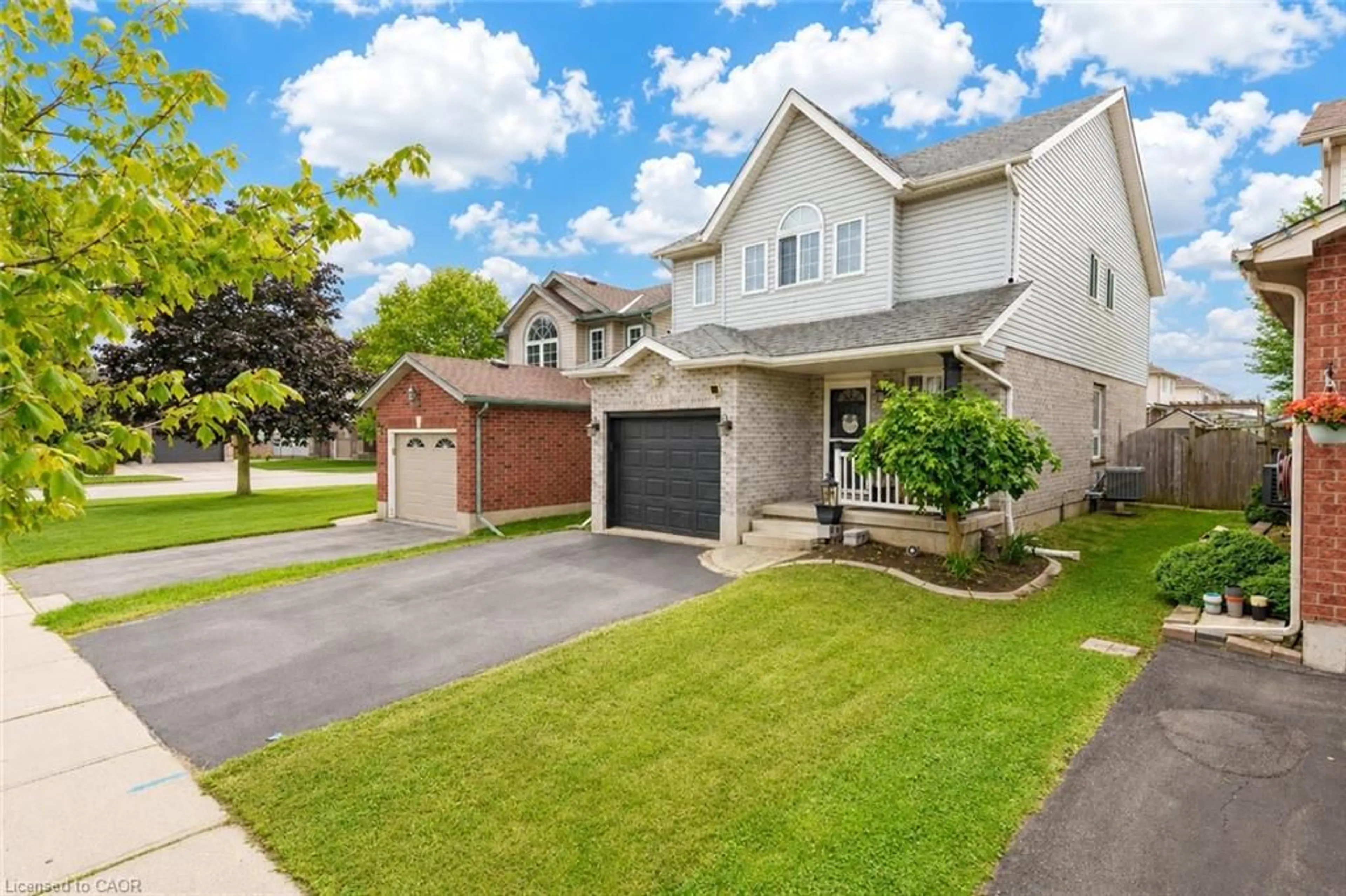 Home with brick exterior material, street for 135 Cotton Grass St, Kitchener Ontario N2E 3T5