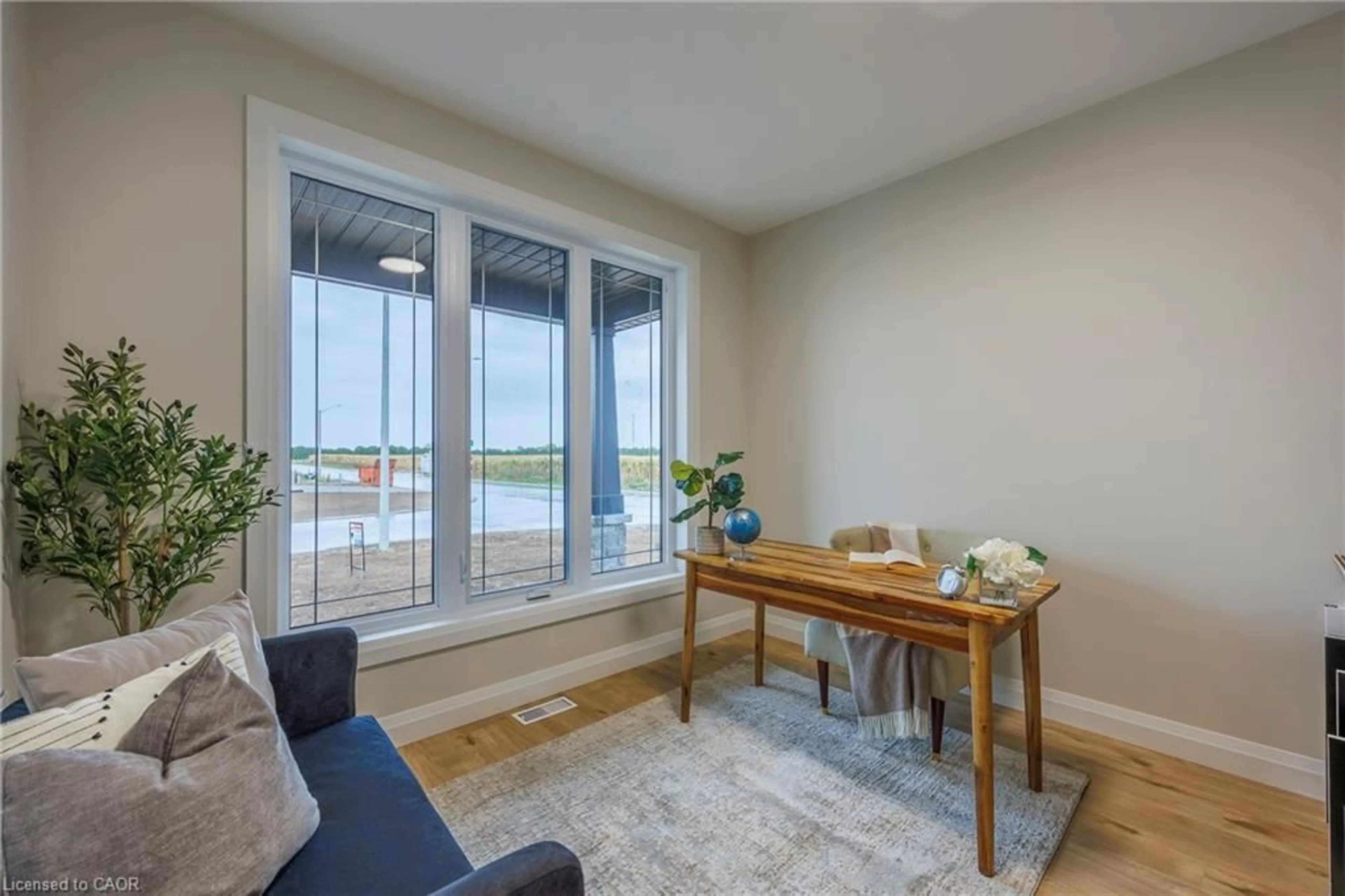 Living room with furniture, wood/laminate floor for 93 Duchess Dr, Delhi Ontario N4B 0B3