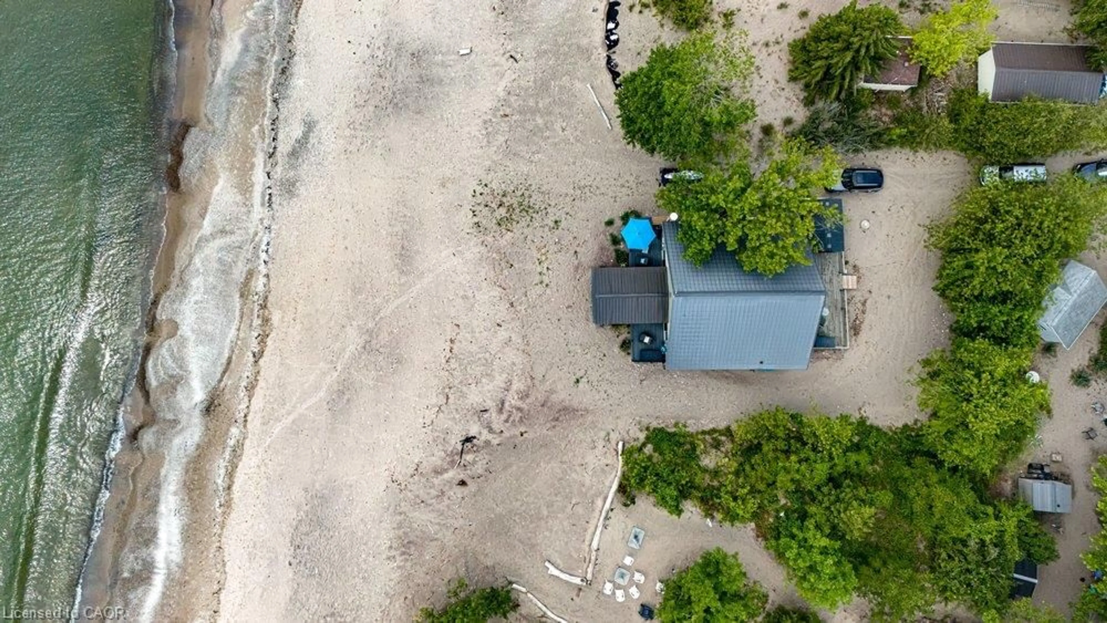 A pic from outside/outdoor area/front of a property/back of a property/a pic from drone, unknown for 50 Grand River Line, Lowbanks Ontario N0A 1K0