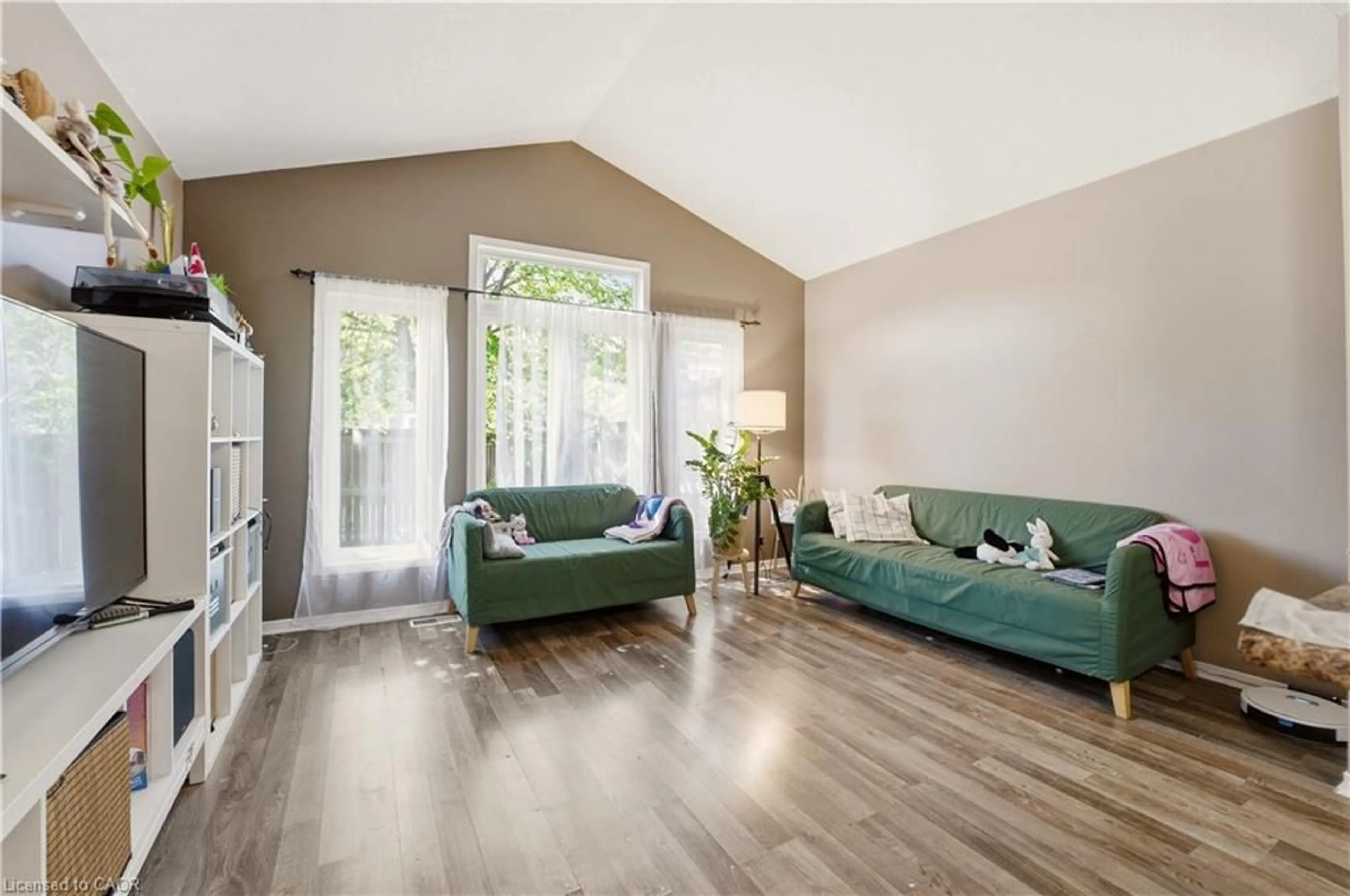 Living room with furniture, wood/laminate floor for 541 Wild Iris Ave, Waterloo Ontario N2V 2W4
