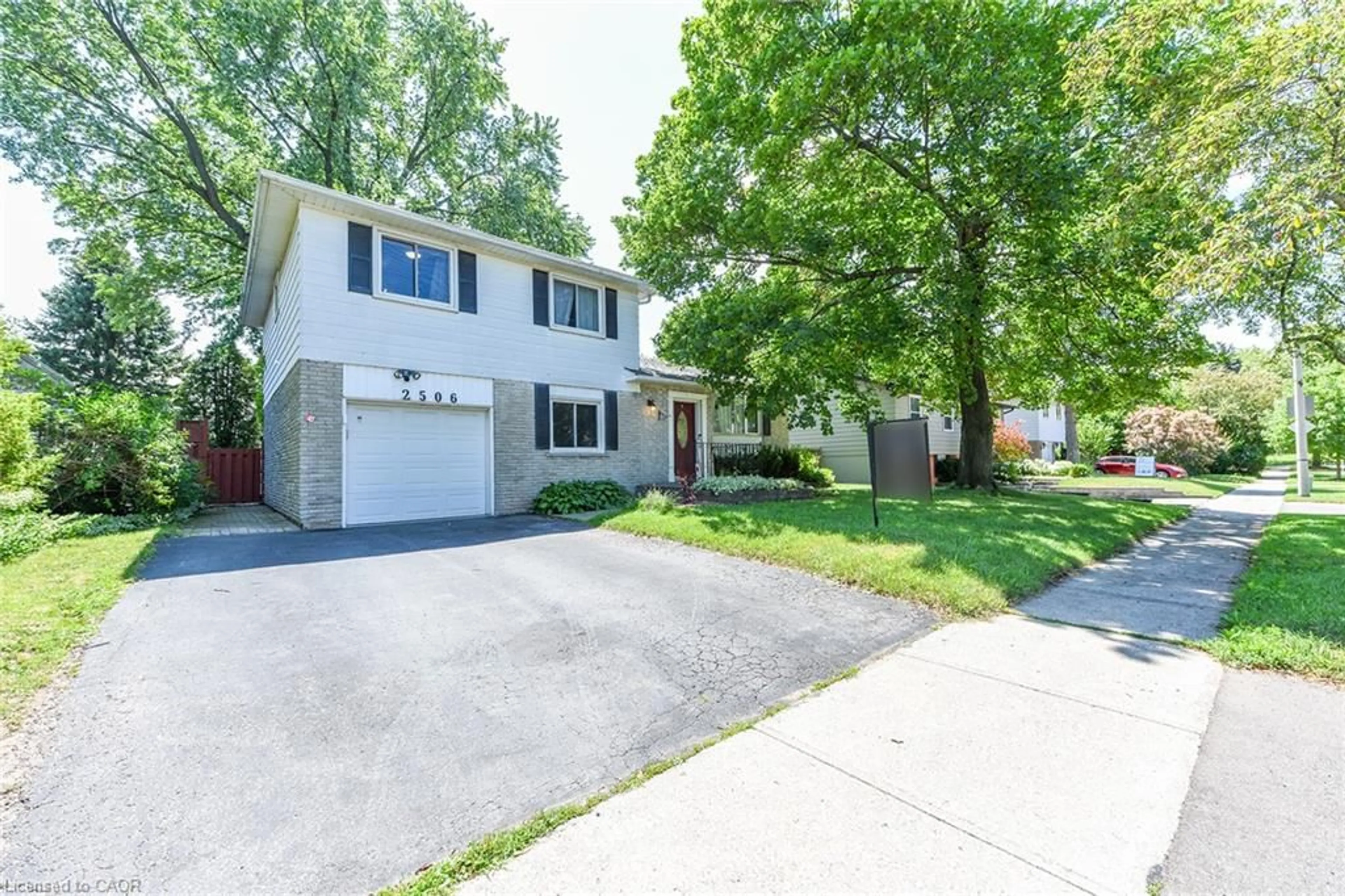 Home with vinyl exterior material, street for 2506 Bridge Rd, Oakville Ontario L6L 2H2