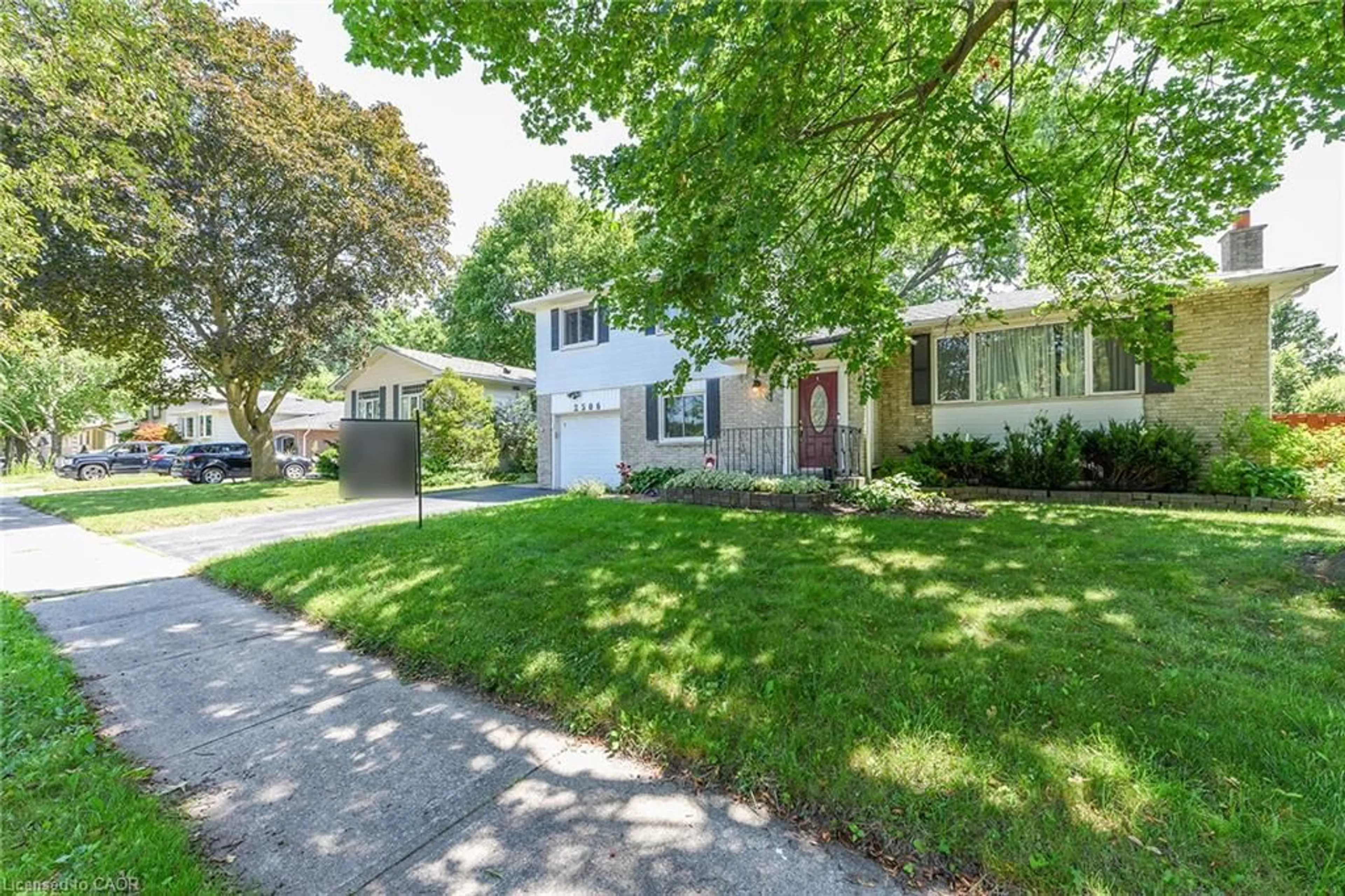 Home with vinyl exterior material, street for 2506 Bridge Rd, Oakville Ontario L6L 2H2