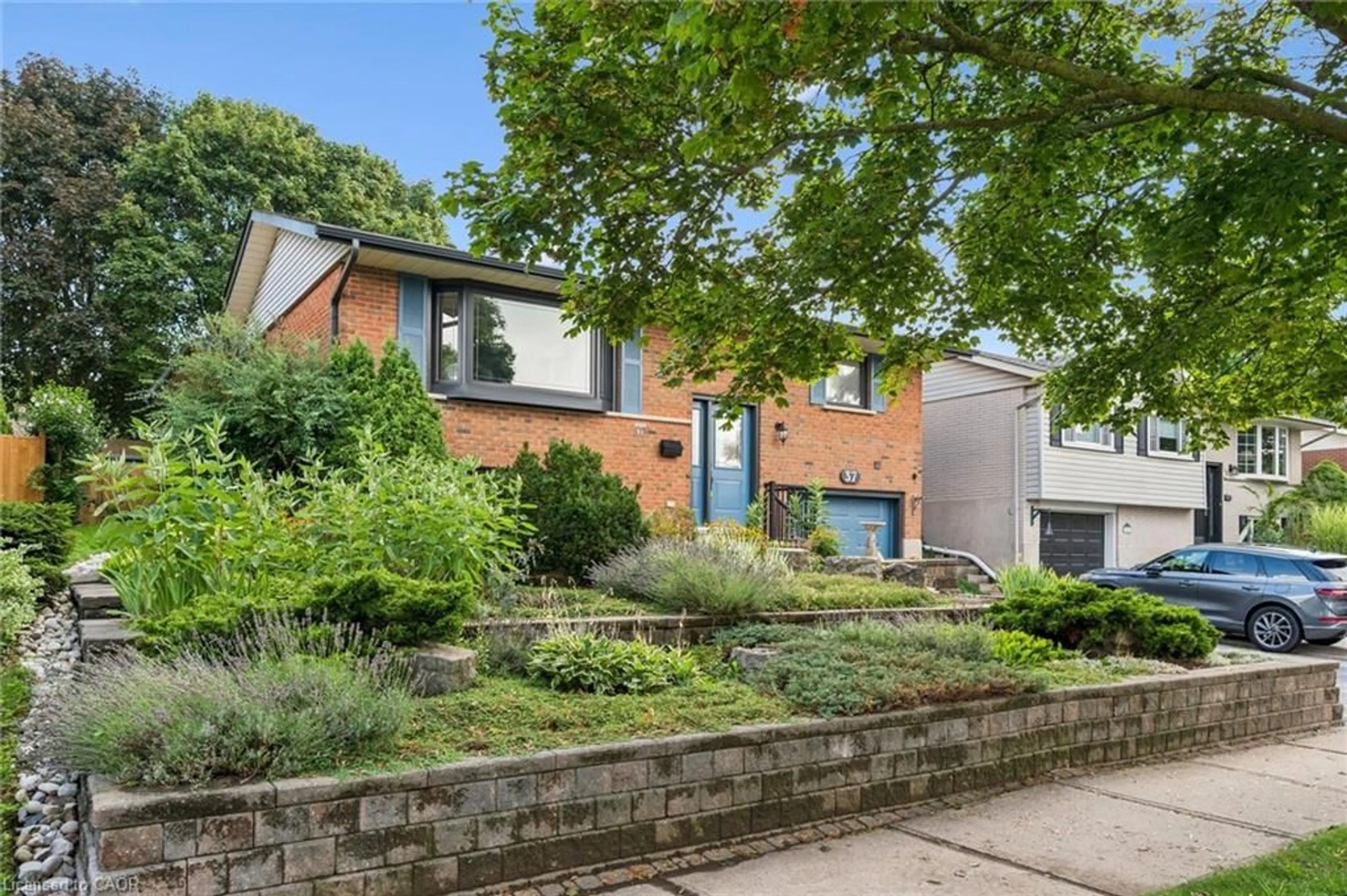 Home with brick exterior material, street for 37 Dunsmere Dr, Kitchener Ontario N2E 1V5