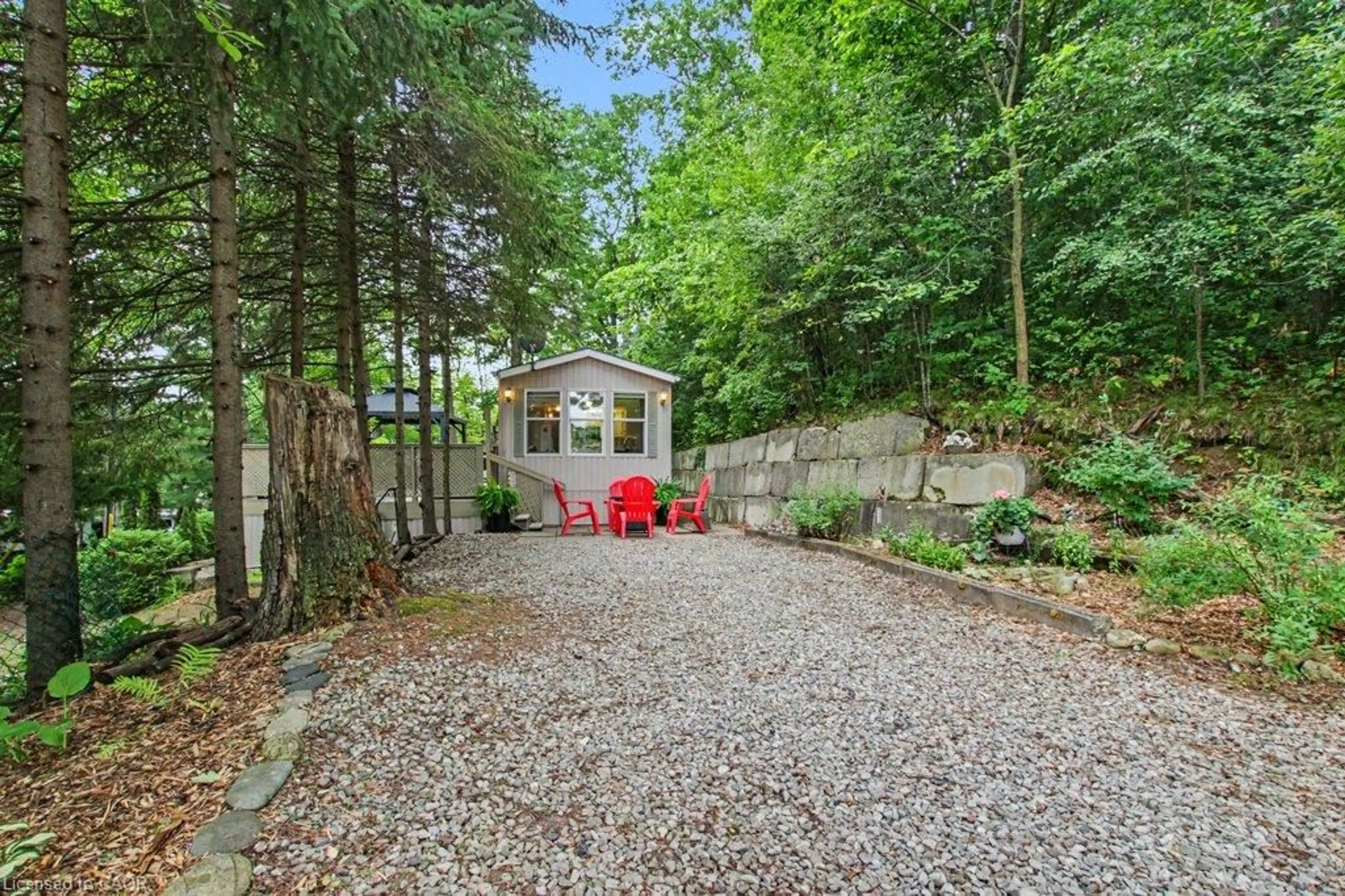 A pic from outside/outdoor area/front of a property/back of a property/a pic from drone, forest/trees view for 673 Brant-Waterloo Rd #77, Ayr Ontario N0B 1E0