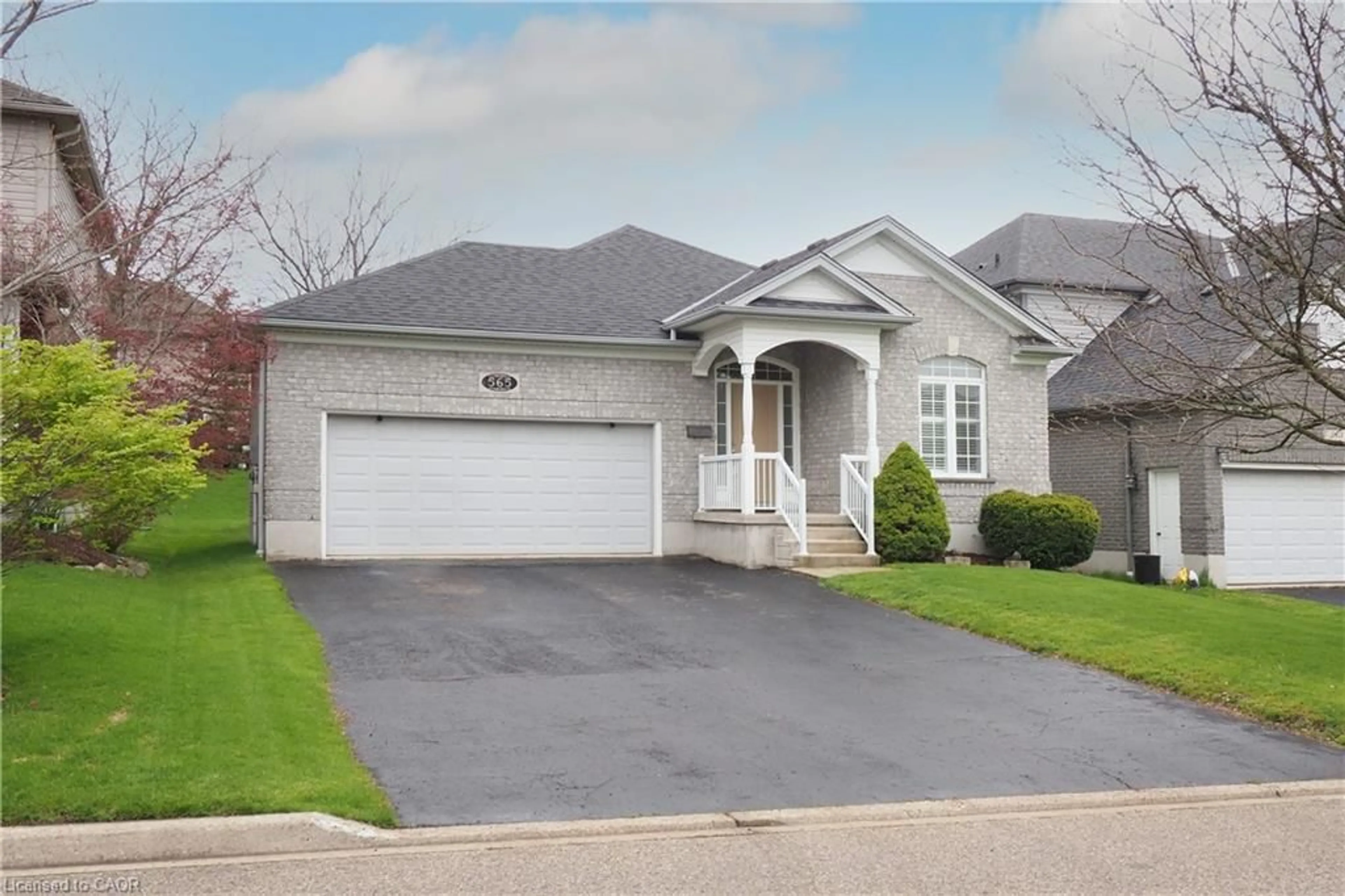 Home with brick exterior material, street for 565 Springwater Dr, Waterloo Ontario N2V 2K6