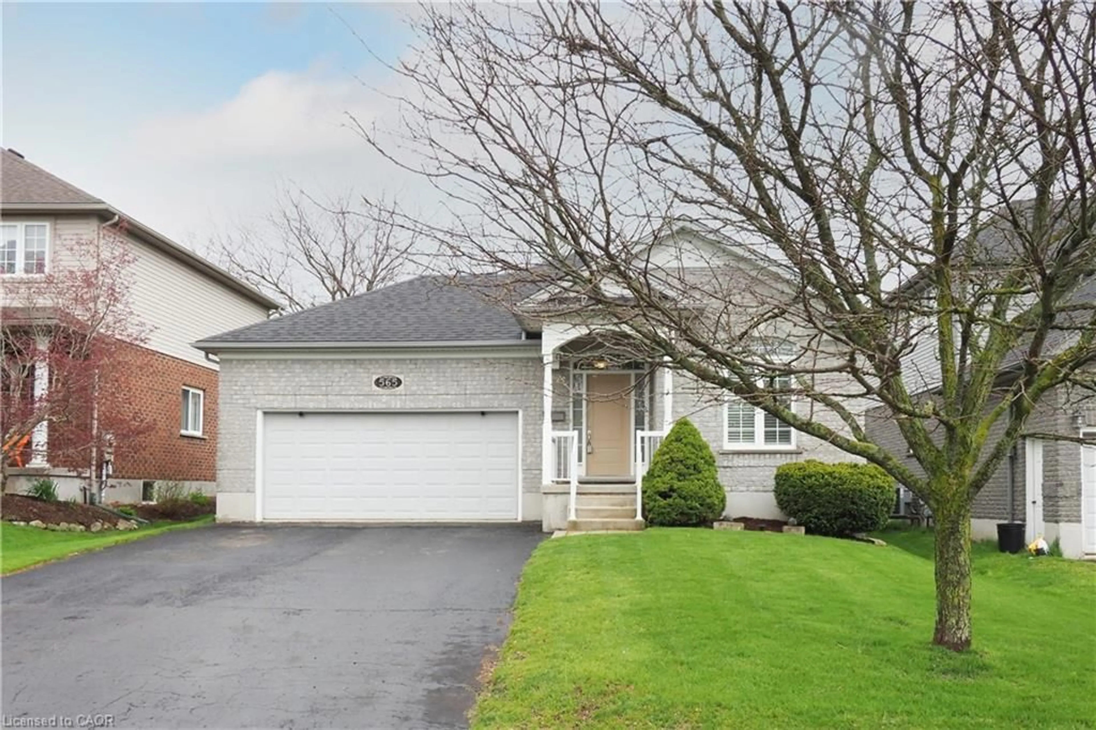 Home with brick exterior material, street for 565 Springwater Dr, Waterloo Ontario N2V 2K6