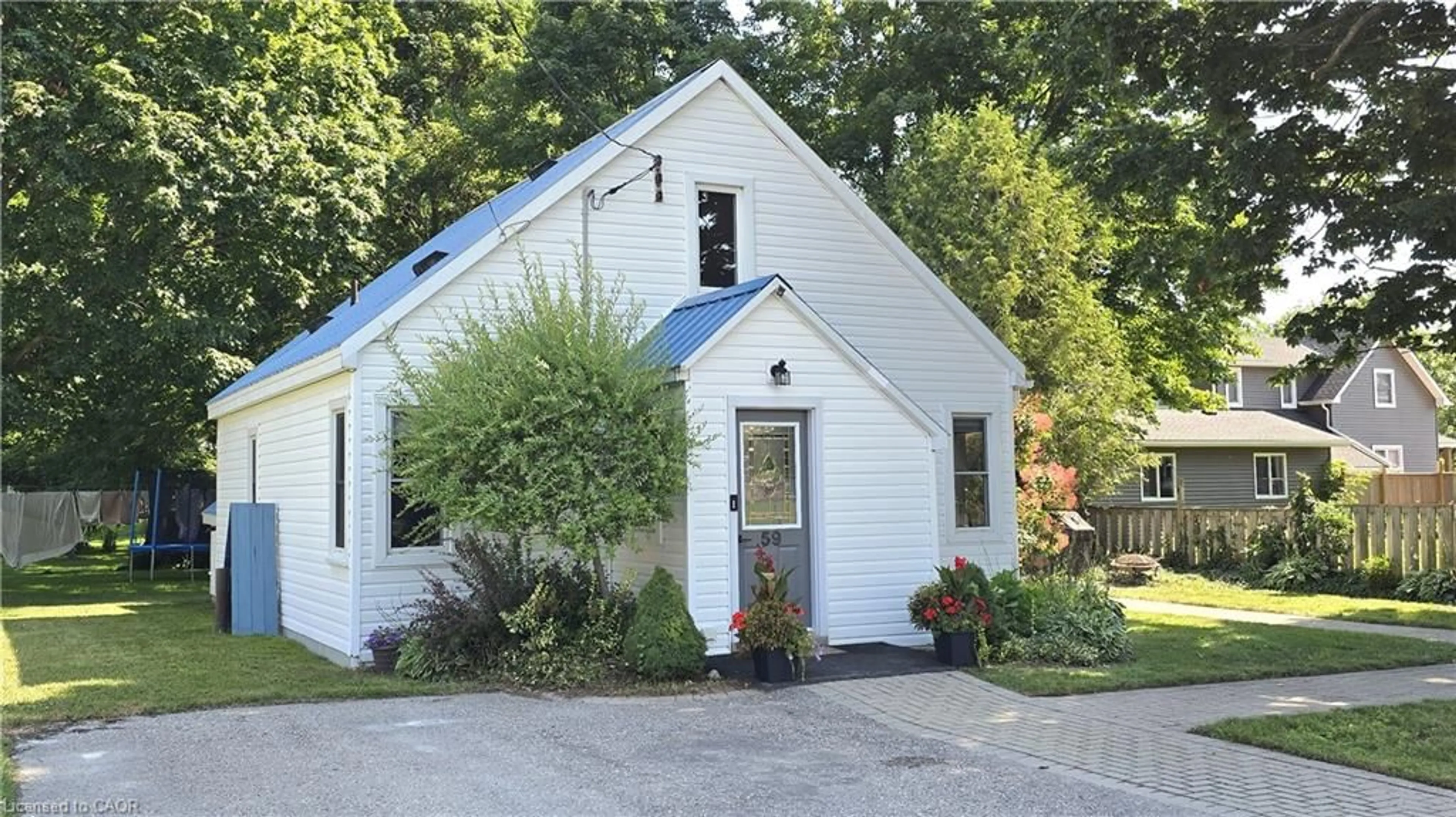 Home with vinyl exterior material, street for 59 Flora St, Brussels Ontario N0G 1H0