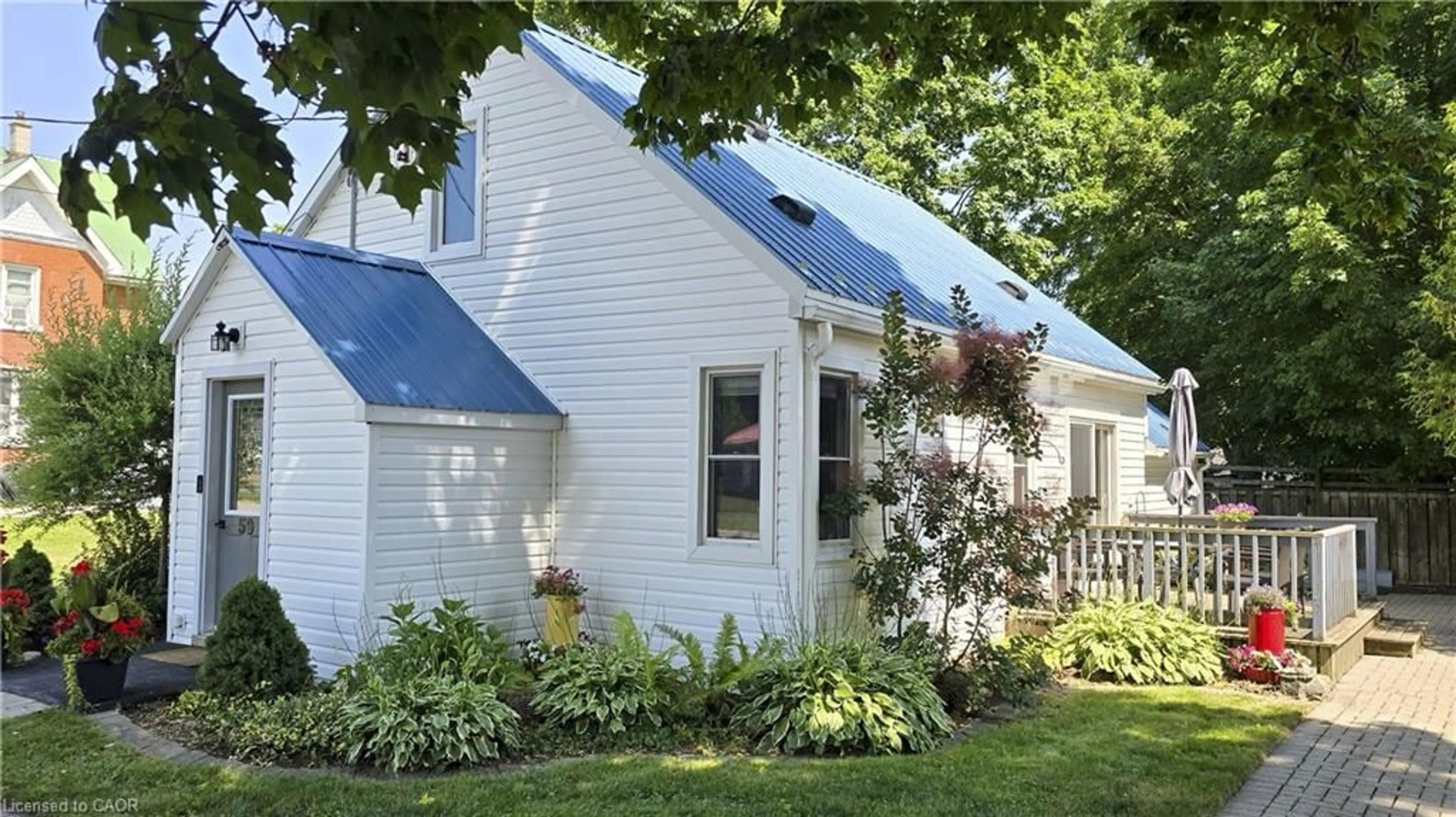 Home with vinyl exterior material, street for 59 Flora St, Brussels Ontario N0G 1H0