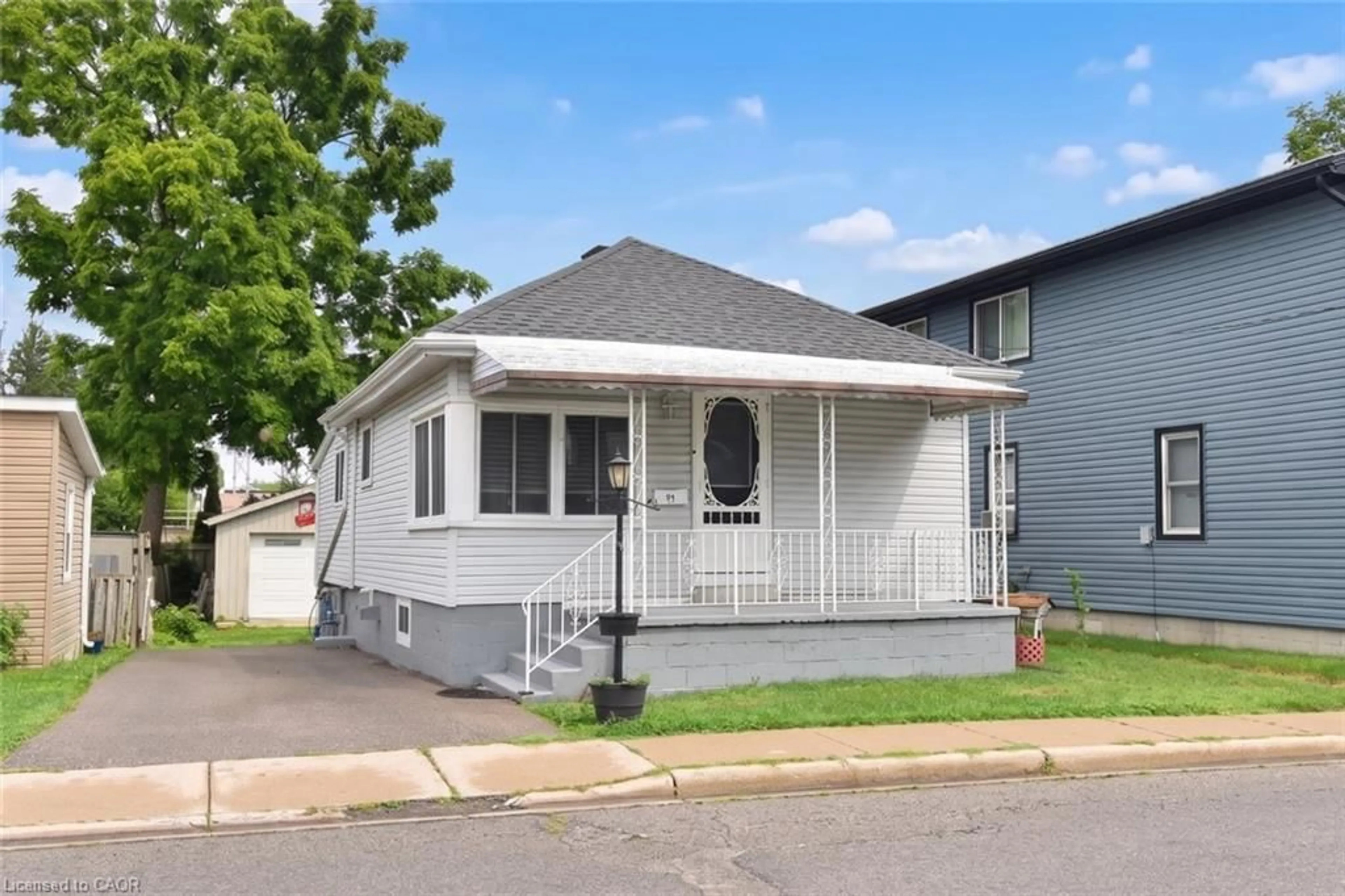 Home with vinyl exterior material, street for 63 Patterson St, Simcoe Ontario N3Y 1J4