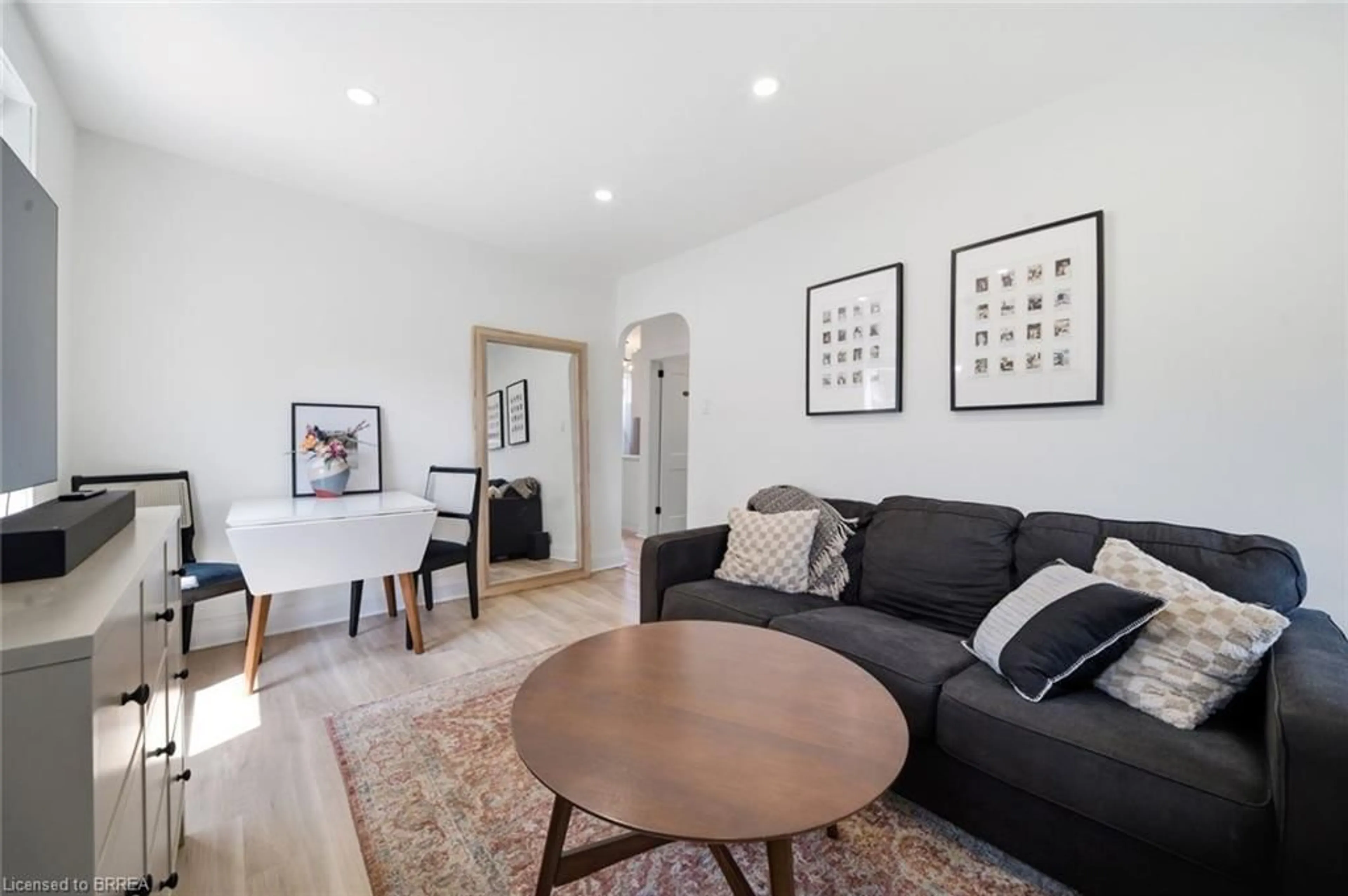 Living room with furniture, wood/laminate floor for 8 Russell St, Brantford Ontario N3R 1Y7