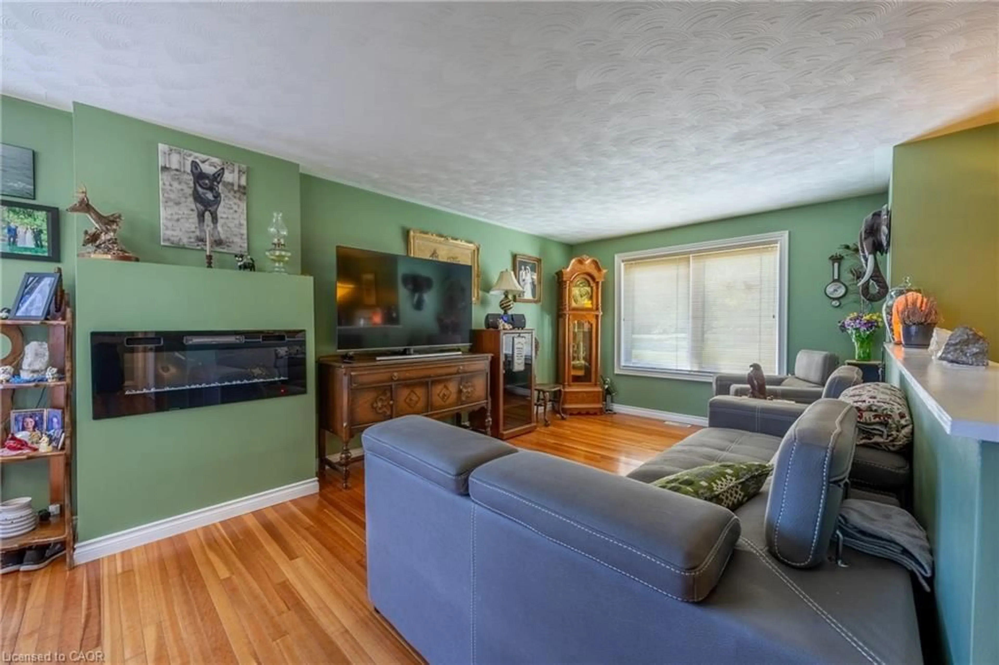 Living room with furniture, wood/laminate floor for 20 Port Ryerse Rd, Port Ryerse Ontario N3Y 4K2